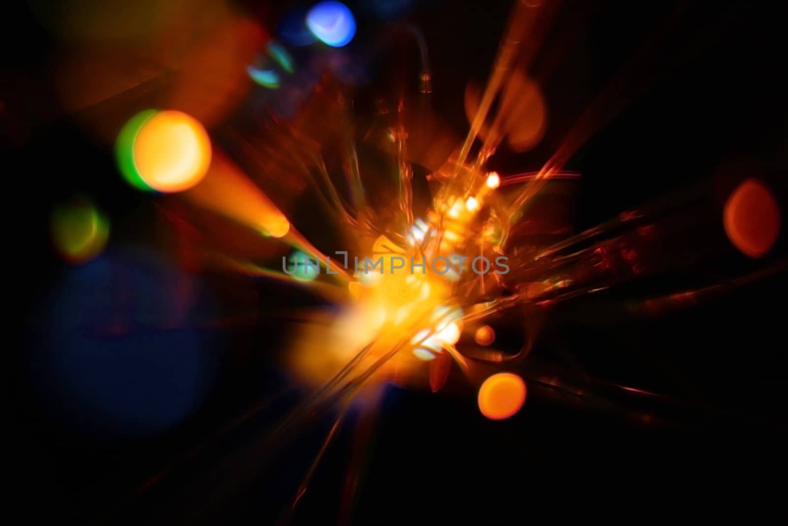 Colorful light explosion on black background. Futuristic wallpaper