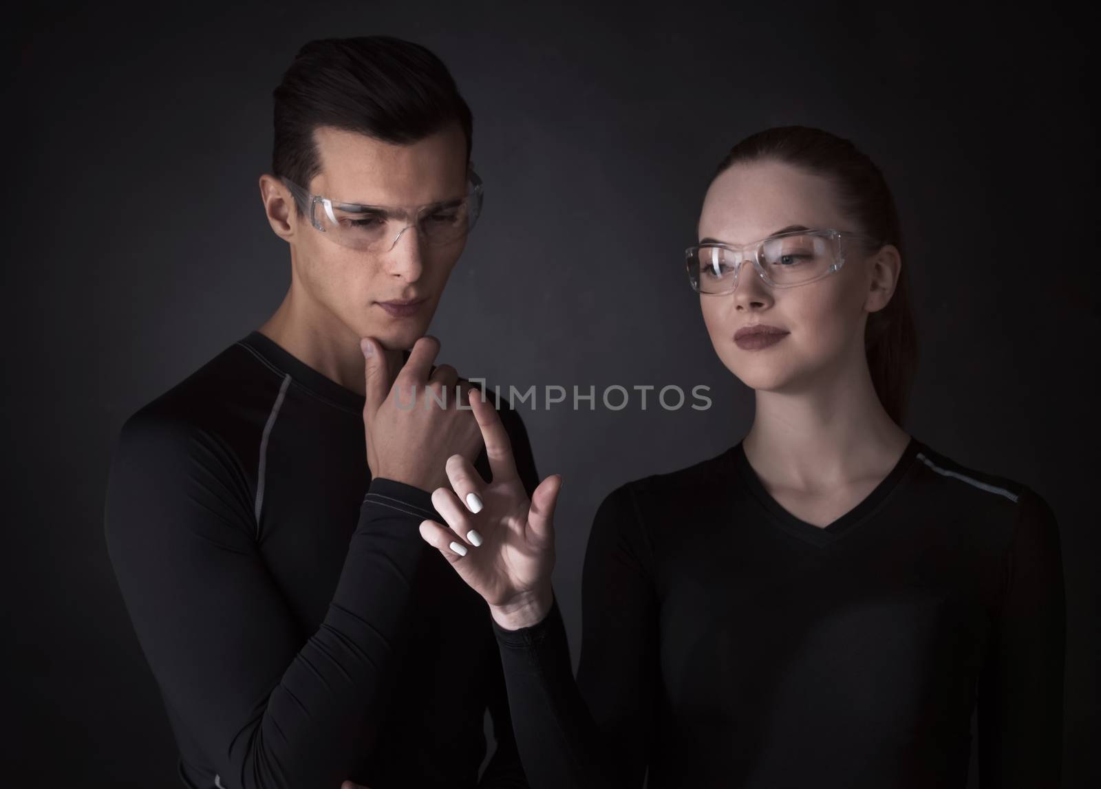 Couple working with futuristic display by ALotOfPeople