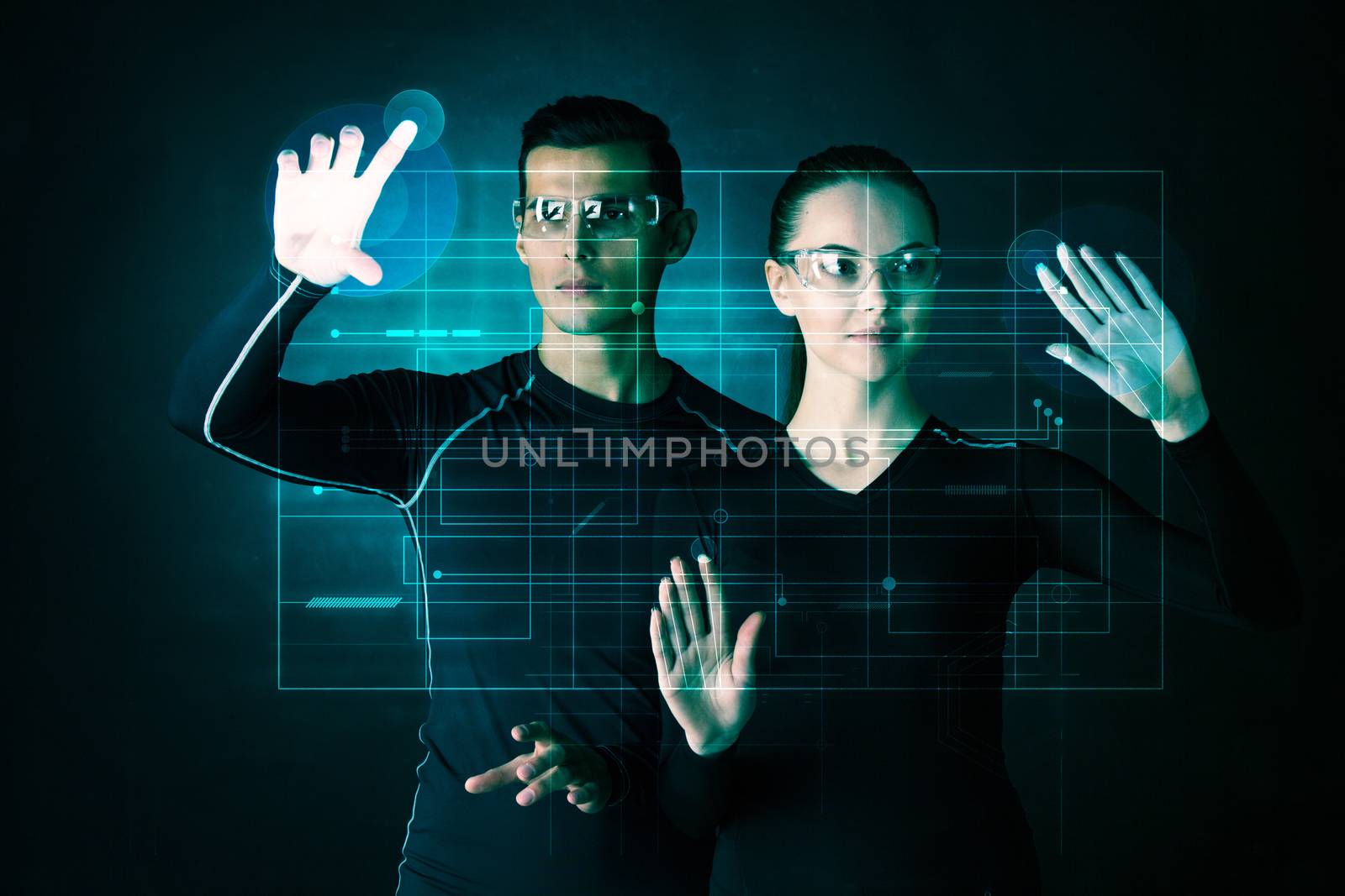 Couple working with futuristic display, innovation, future concept, abtract glowing outline