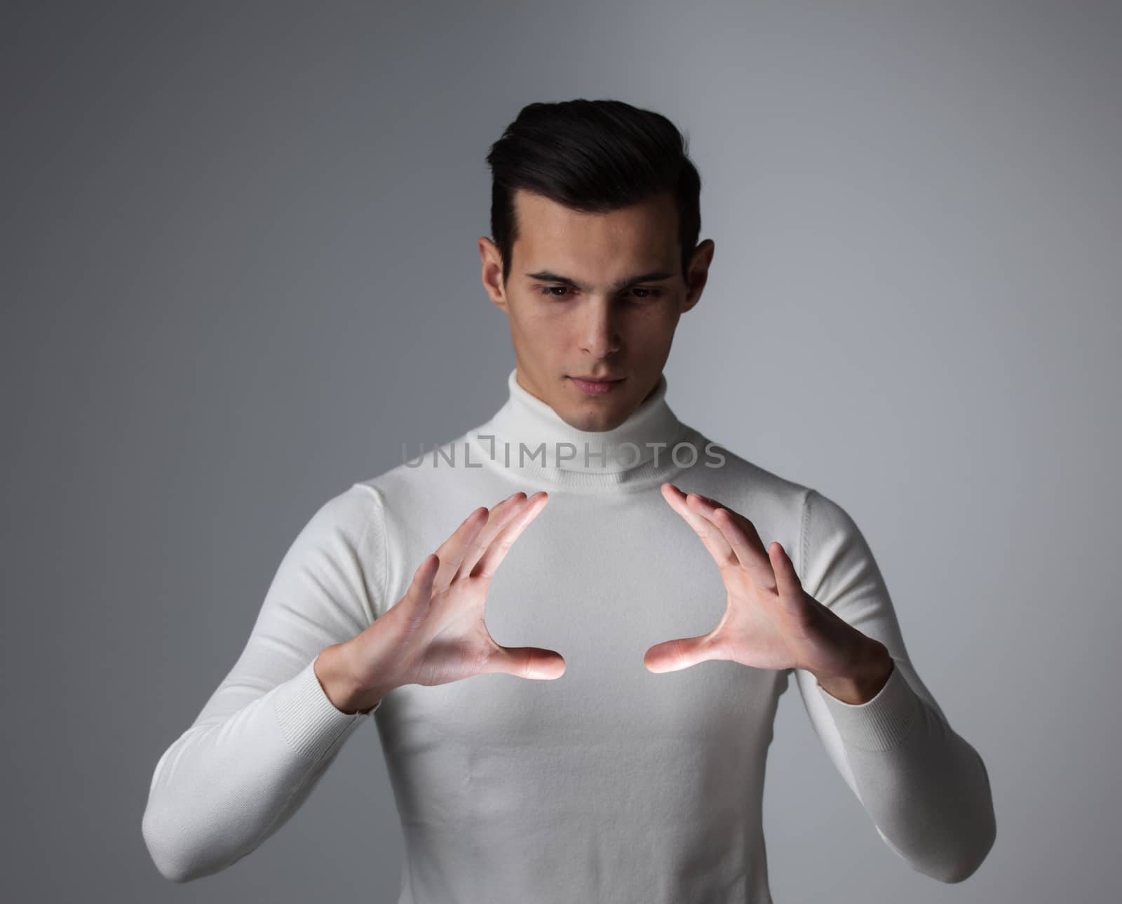 Innovation, future, futuristic object concept, man holding abstract glowing object, copy space for text design