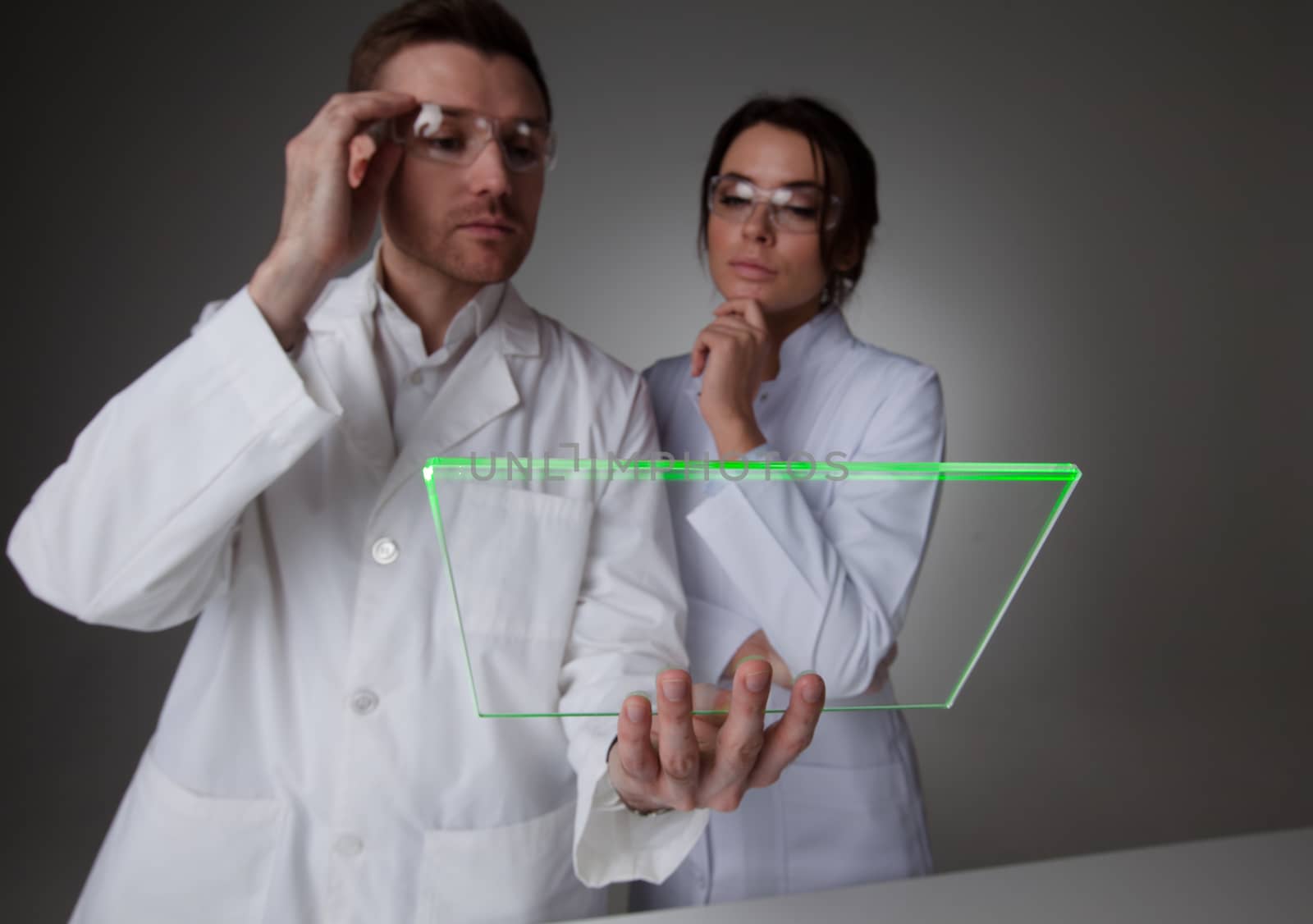 Two scientists with futuristic tablet by ALotOfPeople