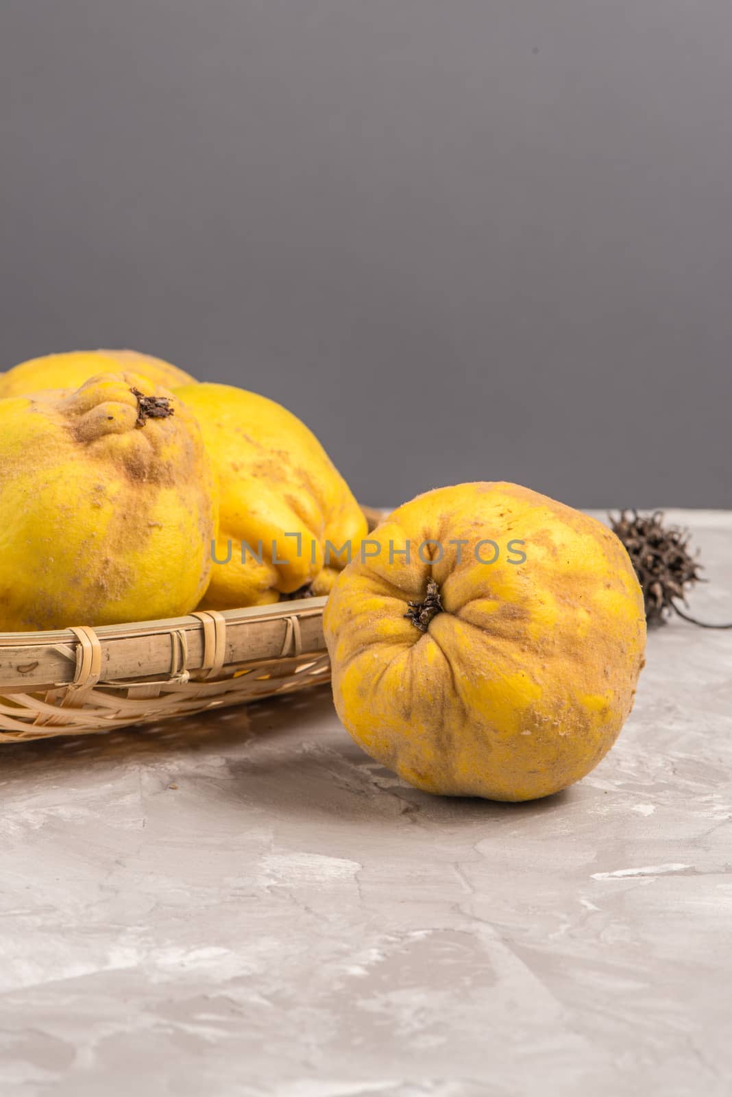 Ripe quince fruits on kitchen countertop.