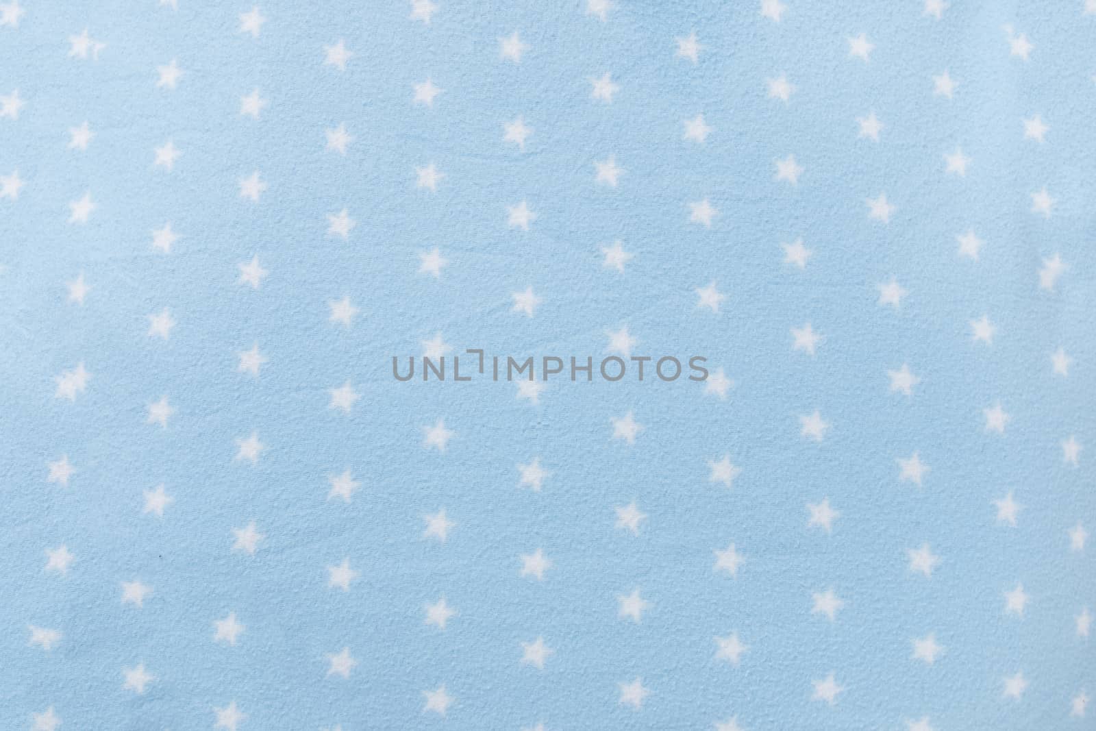 Texture background of a star shape blue wool blanket.