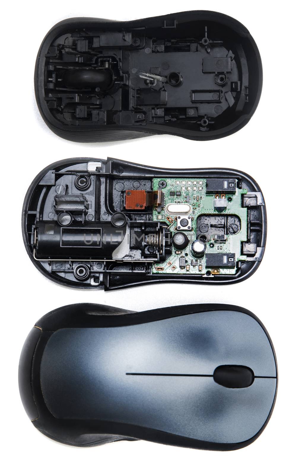 Computer Wheel mouse opened to see circuits inside isolated on a white background.