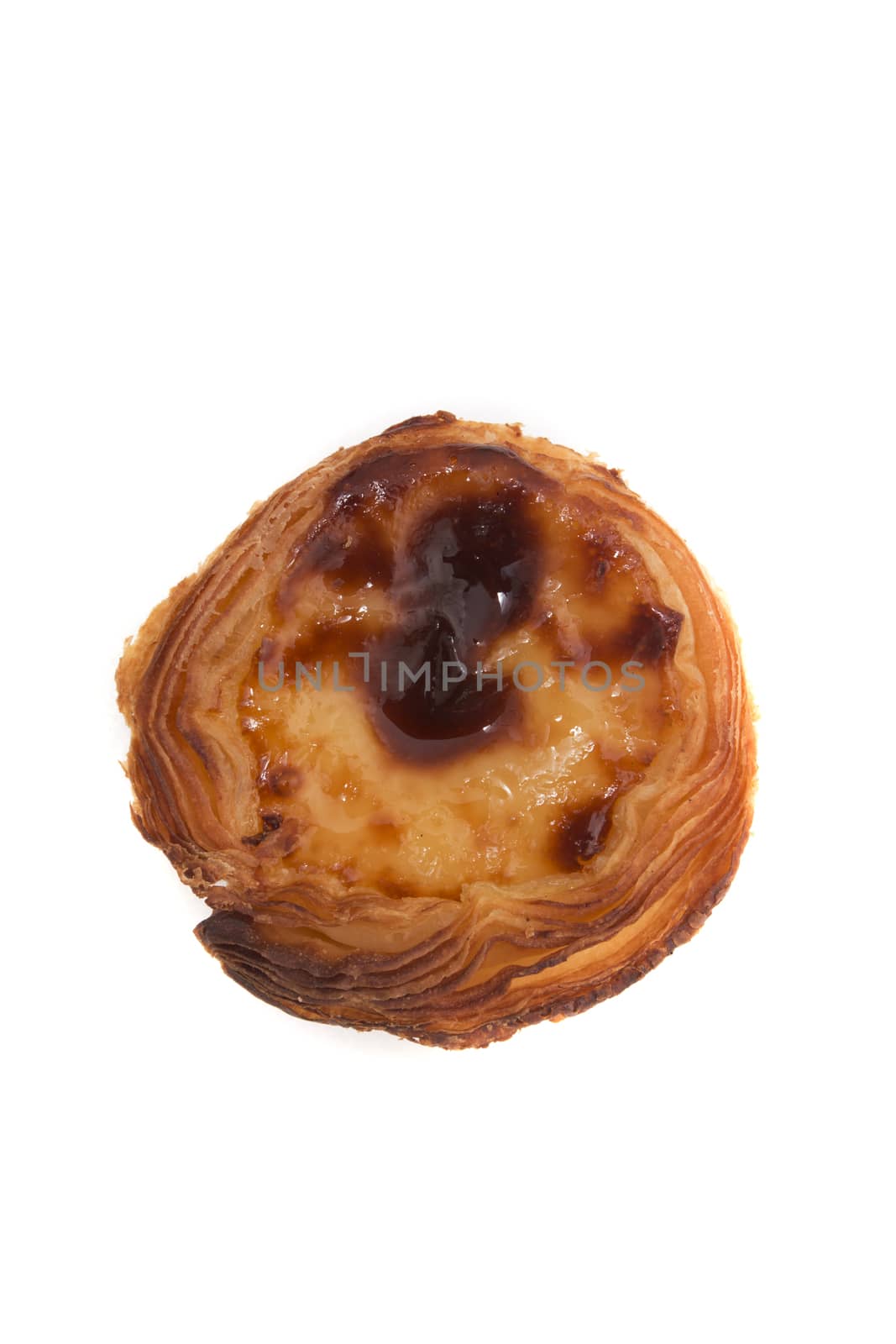 Famous Portuguese egg pastry tart called 'Pastel de Belem' isolated on white background.