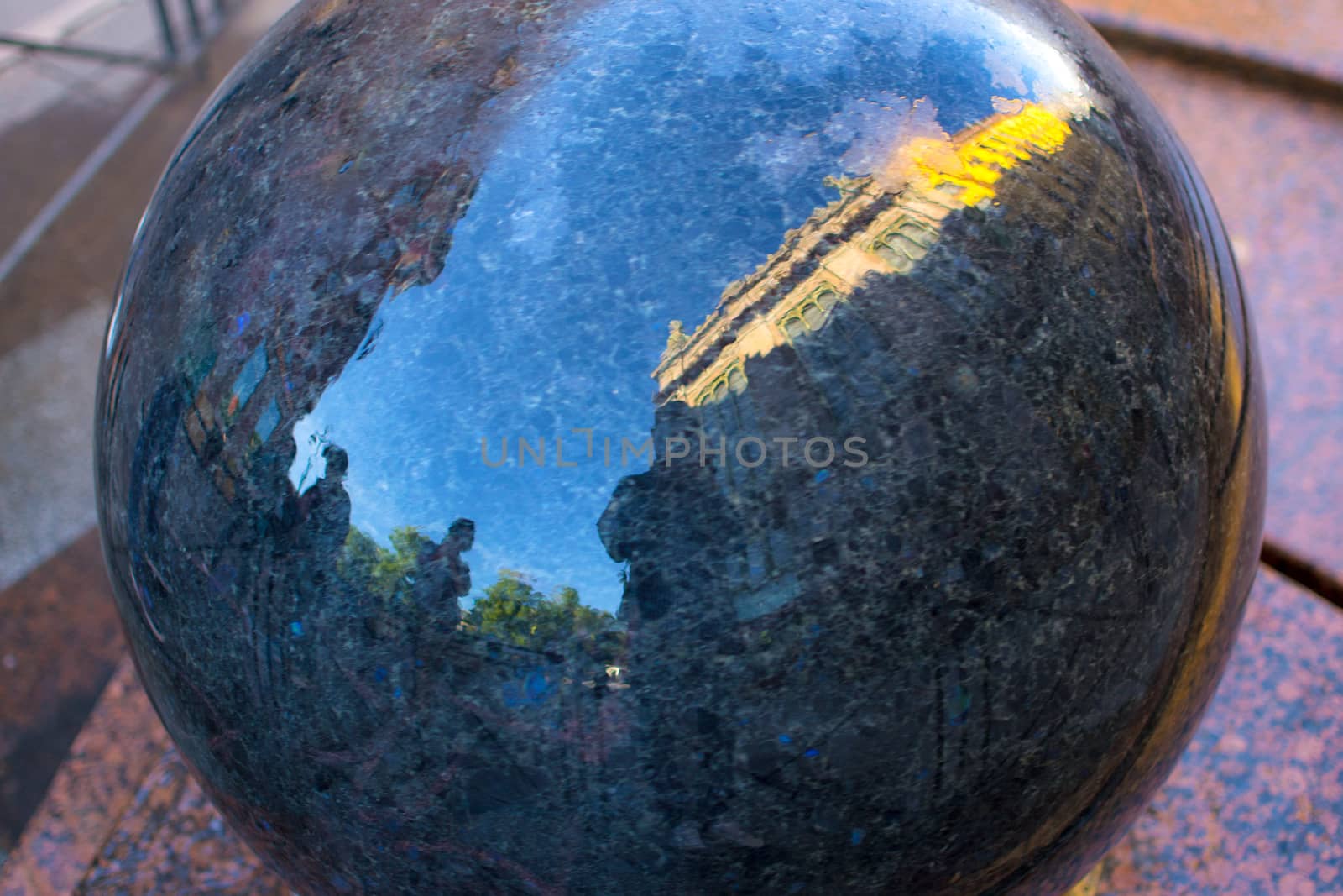 a person's reflection in the ball of the city of St. Petersburg