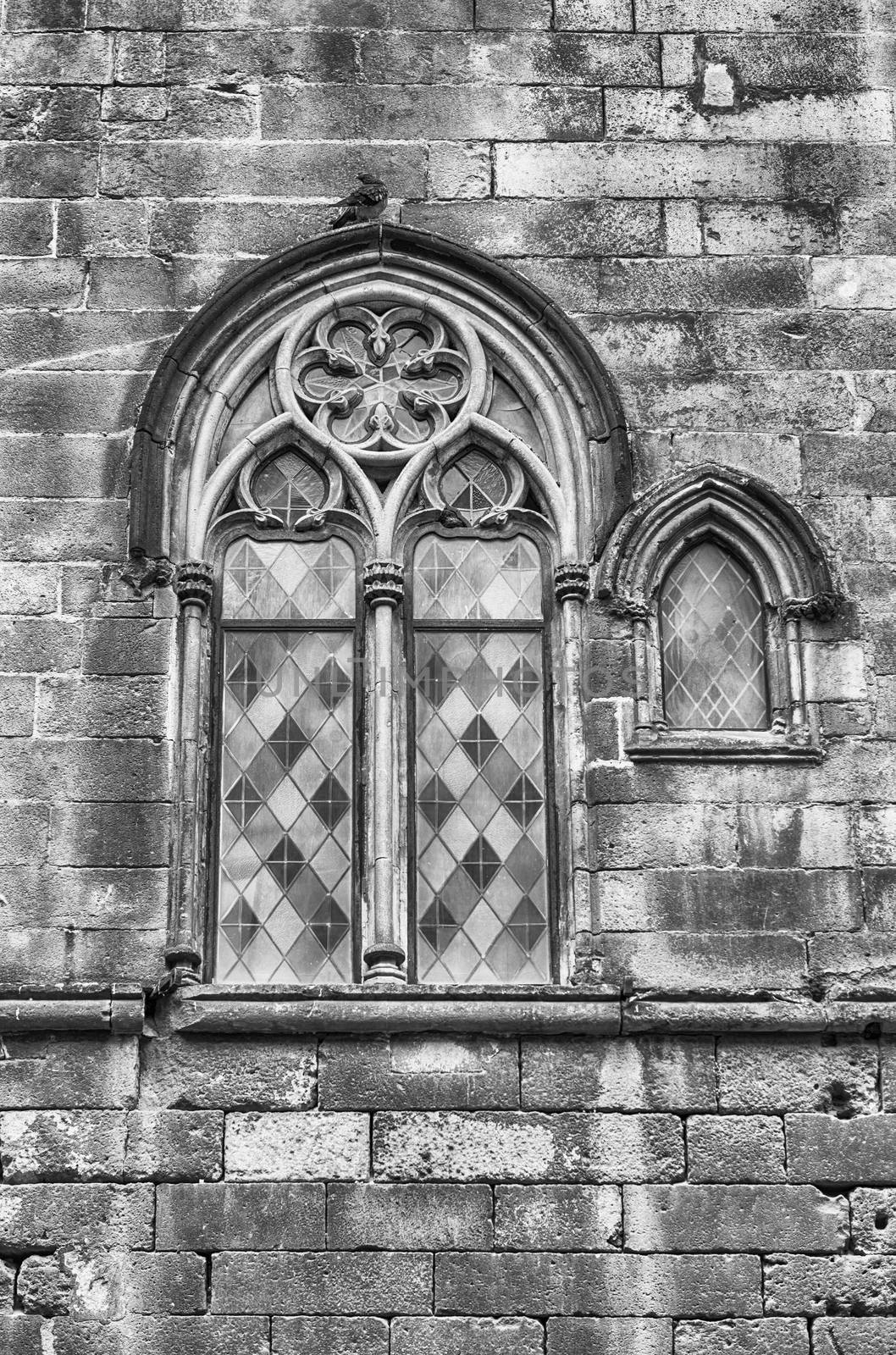 Medieval window of Palau Reial Major in Placa del Rei, public square of the Gothic Quarter in Barcelona, Catalonia, Spain