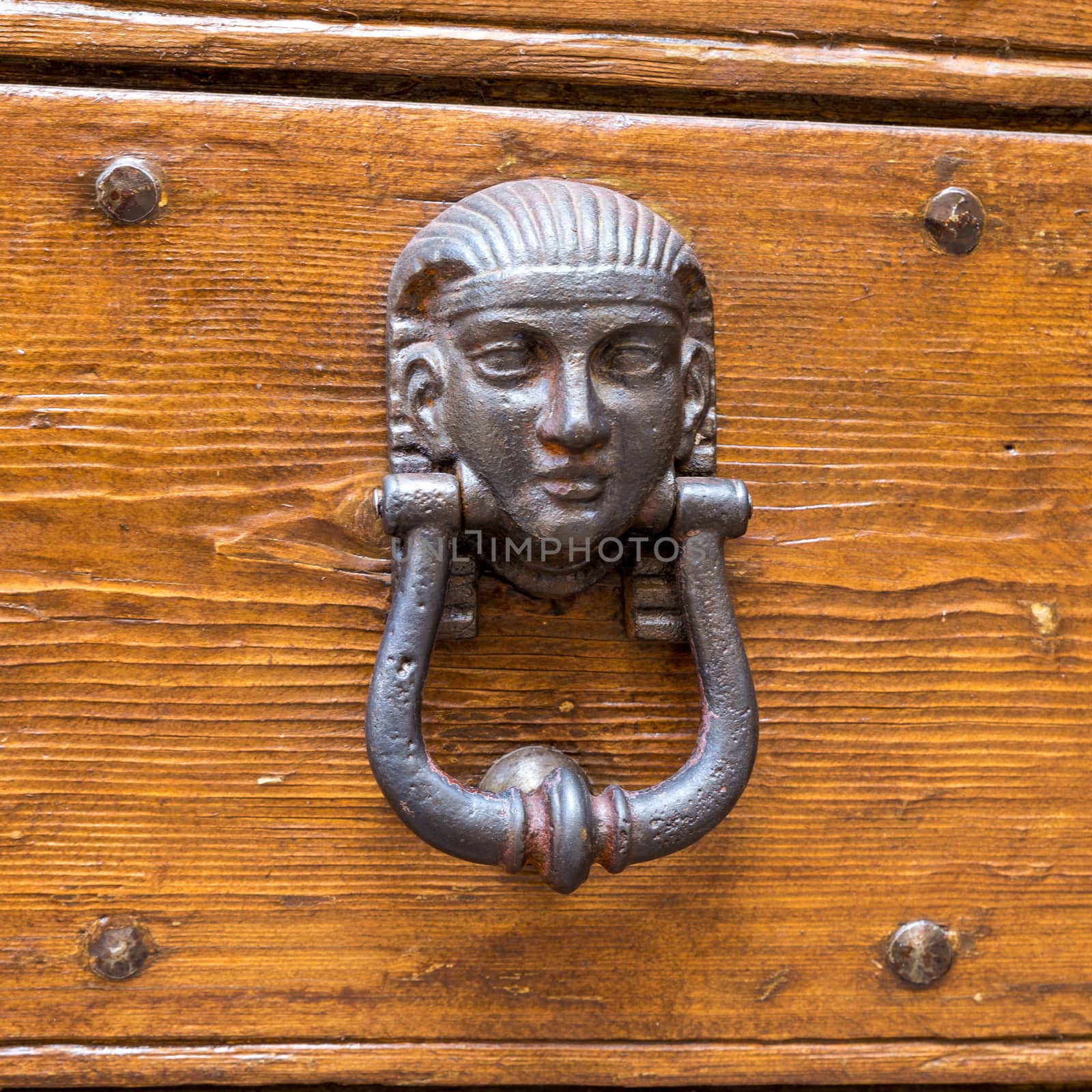 Close up of rustic old door in Spoleto, Italy.