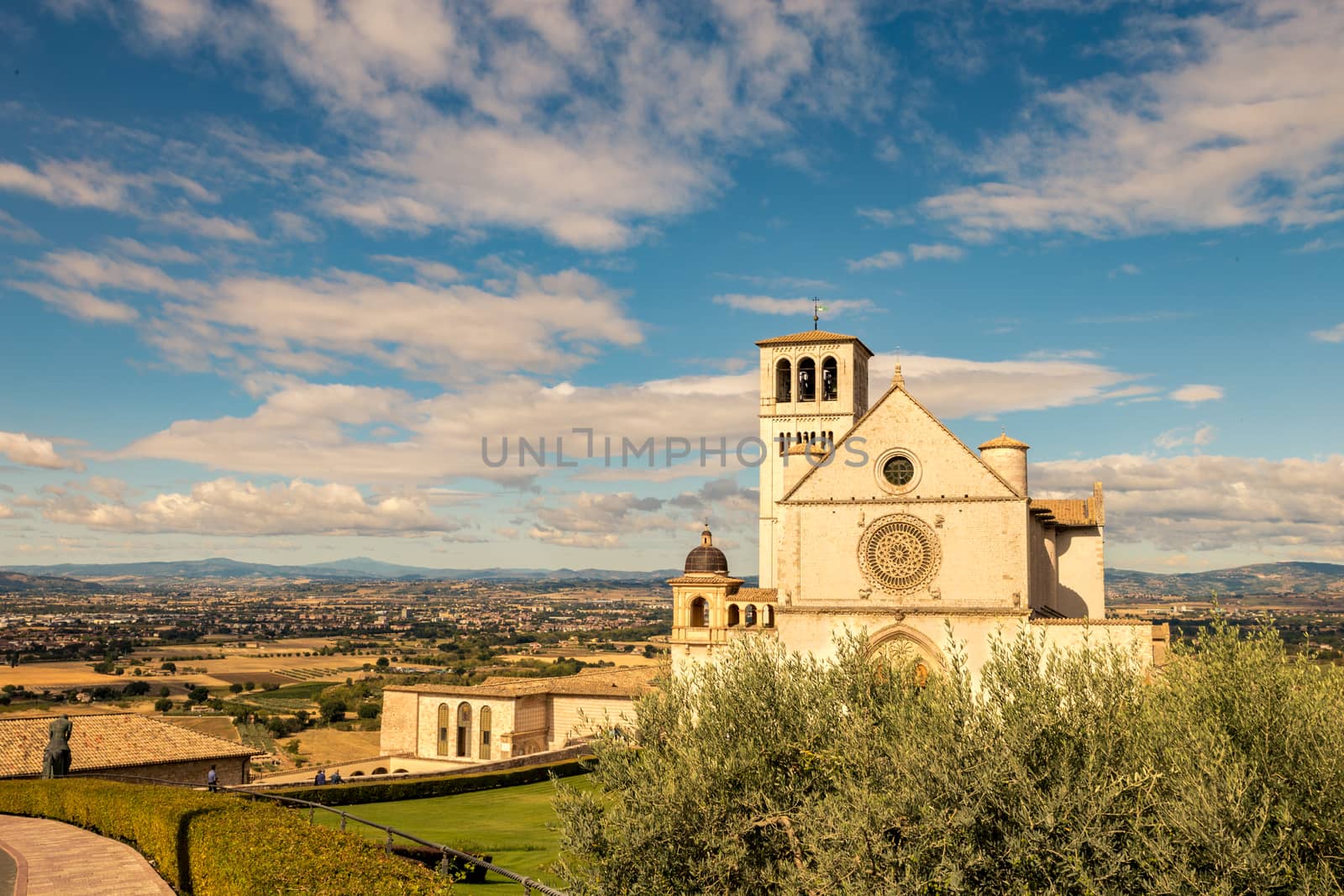 St. Francis of Assisi Church with the statue of St. Francis on a horse in the foreground. St. Francis is the patron saint of Italy. The bell tower can be seen from miles away.