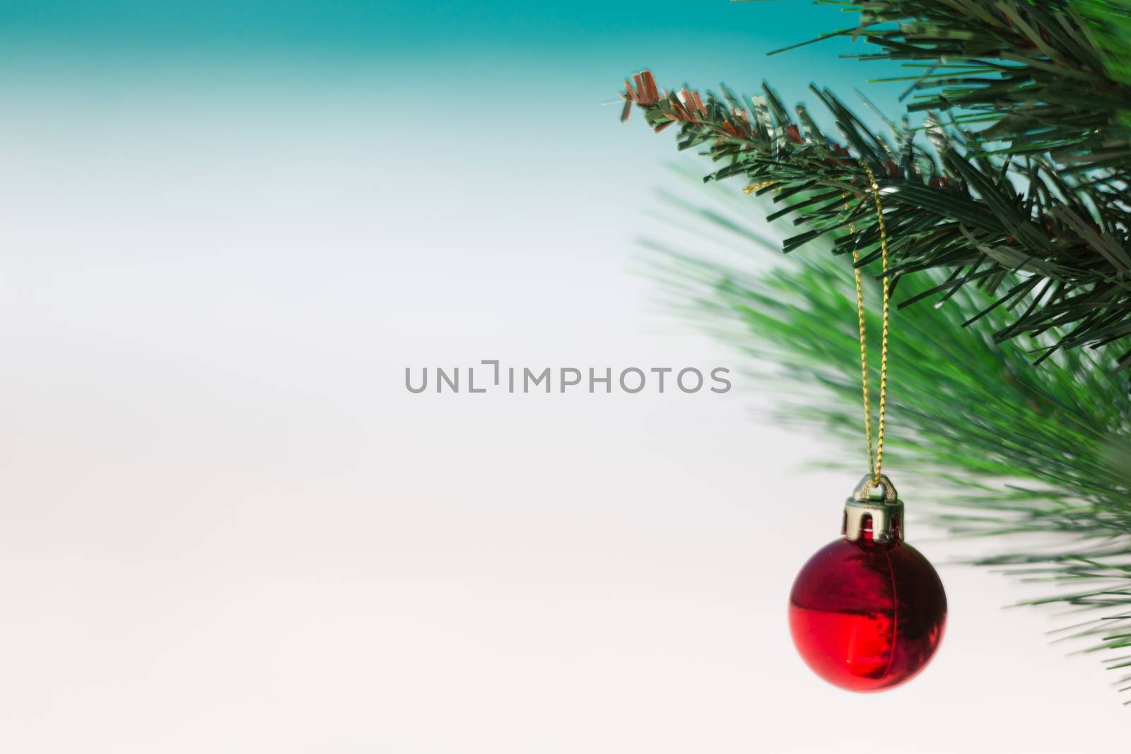 Christmas tree at the beach.  Closeup with focus on red bauble shallow dof and lots of space for copy
