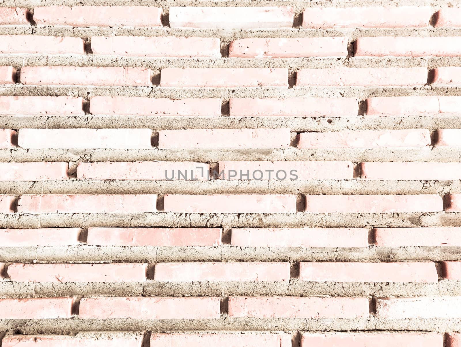 Grungy painted brick wall texture as background. Cracked concrete vintage brick wall background, old painted wall. Background brick painting