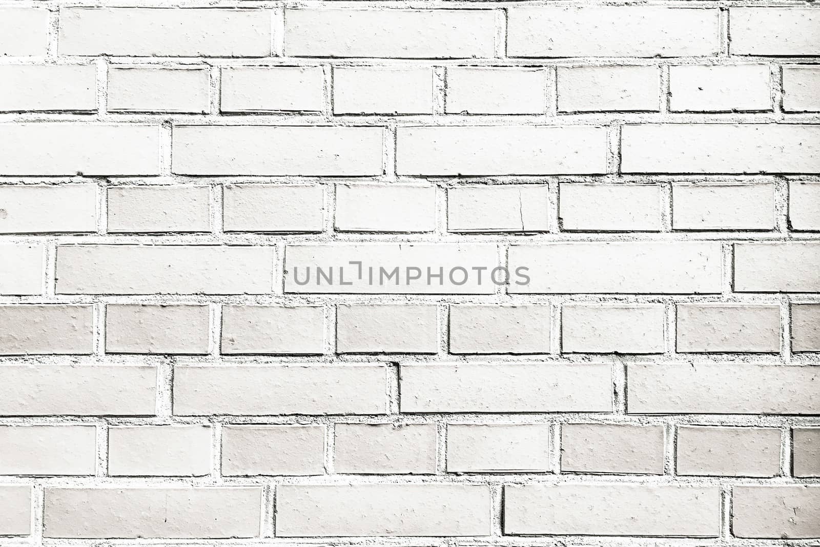 Grungy painted brick wall texture as background. Cracked concrete vintage brick wall background, old painted wall. Background brick painting