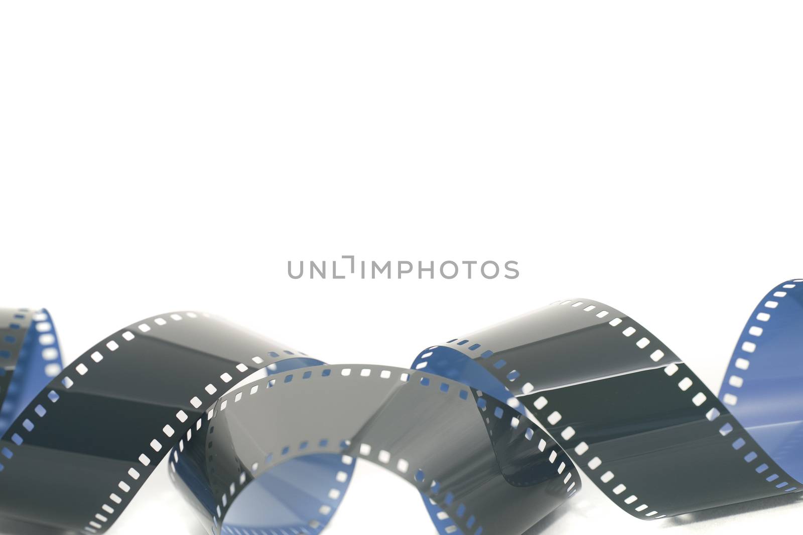 Coiled strip of 35mm photographic film unrolled and exposed forming a lower border over white with copy space