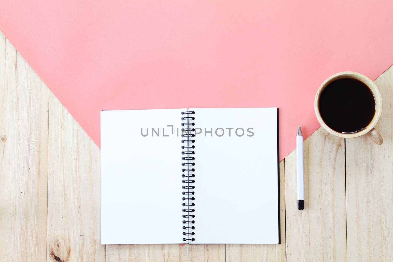 Still life, business, office supplies or education concept : Top view image of open notebook with blank pages and coffee cup on wooden background, ready for adding or mock up