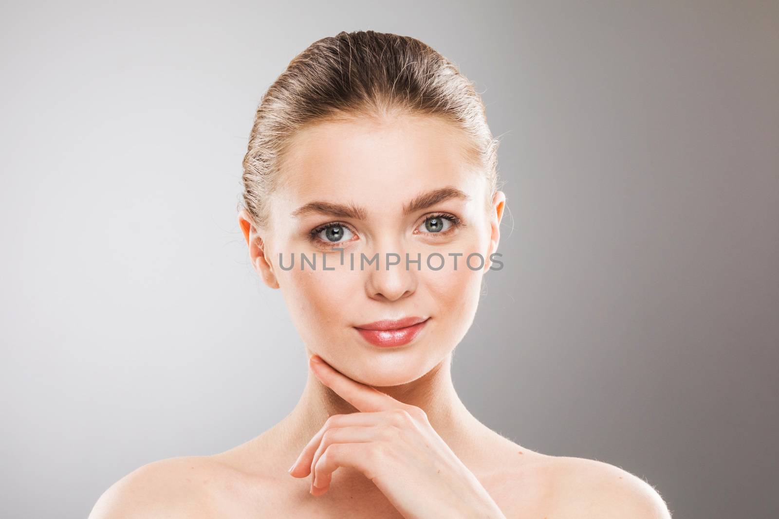 Beauty woman face portrait. Beautiful spa model girl with perfect fresh clean skin. Female looking at camera. Youth and skin care Concept