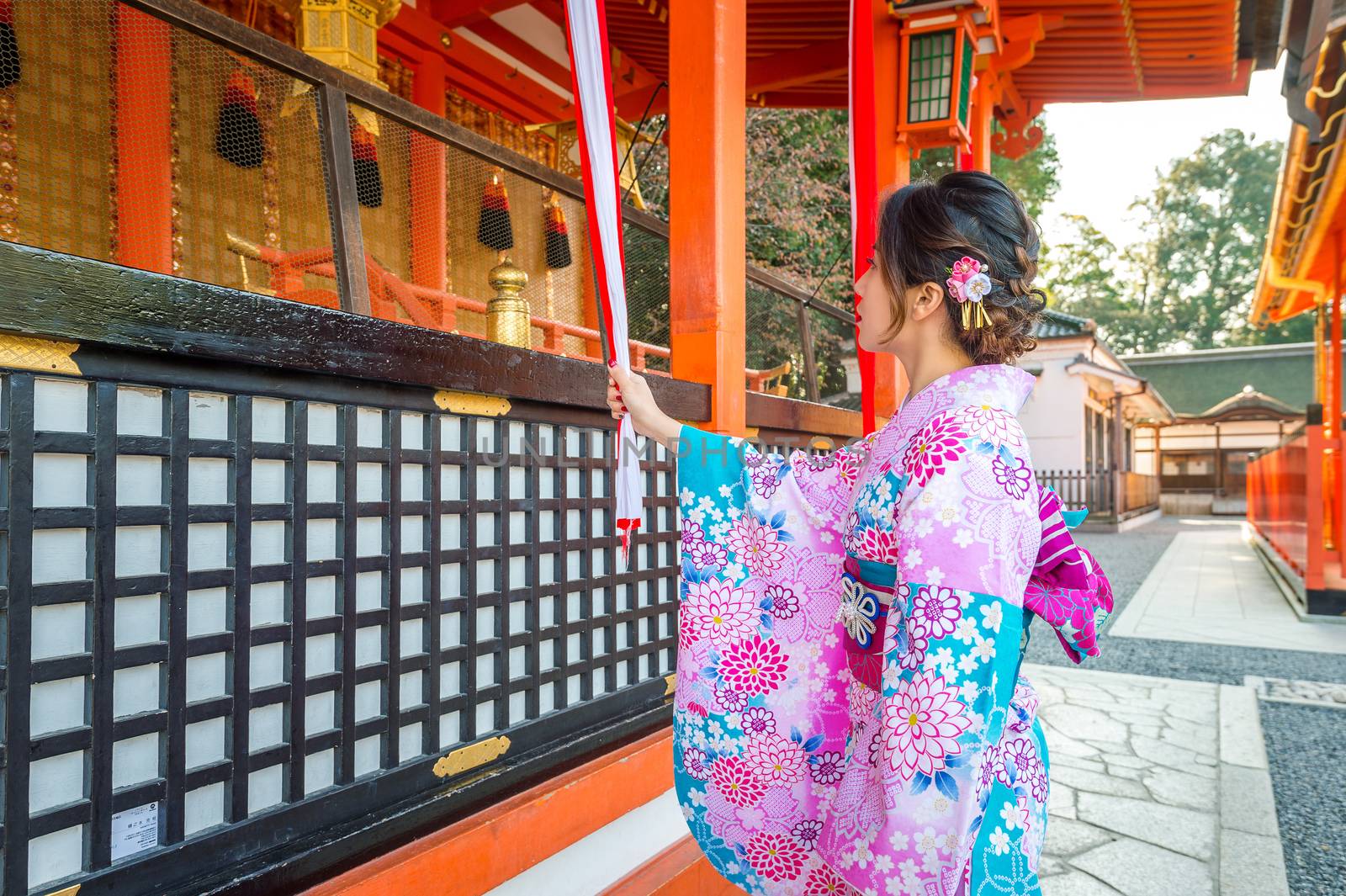 Women in traditional japanese kimonos at Fushimi Inari Shrine in Kyoto, Japan by gutarphotoghaphy