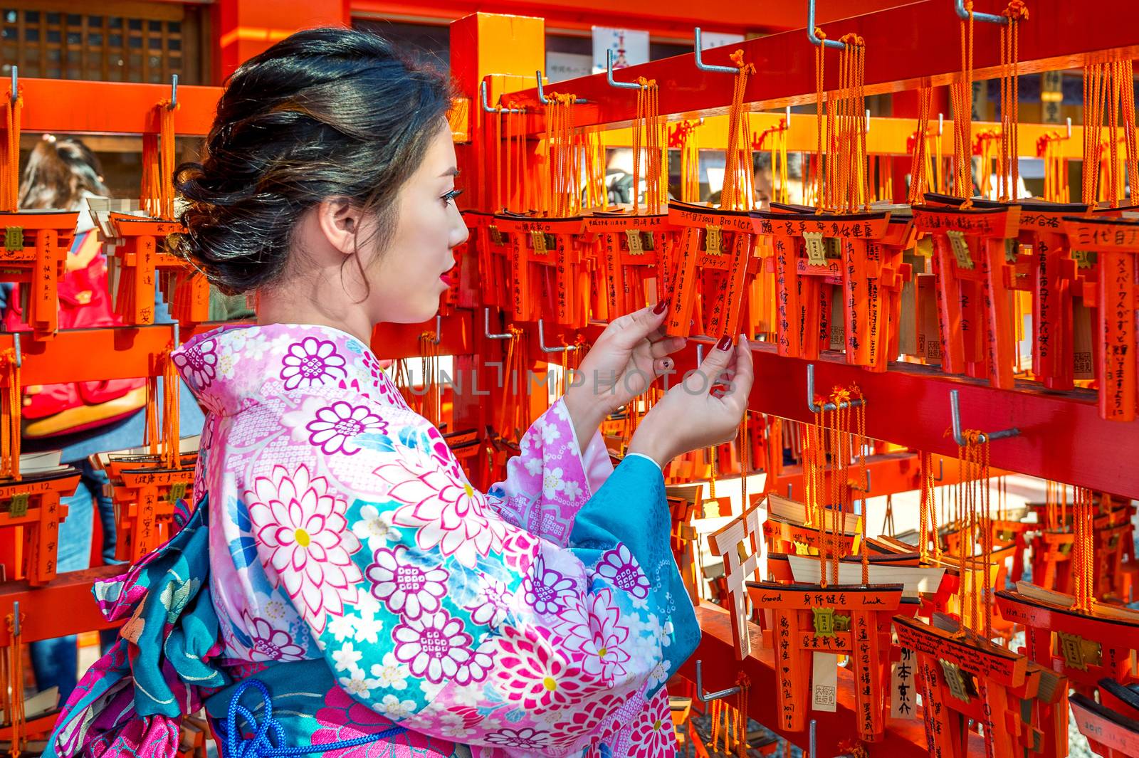 Women in traditional japanese kimonos at Fushimi Inari Shrine in Kyoto, Japan