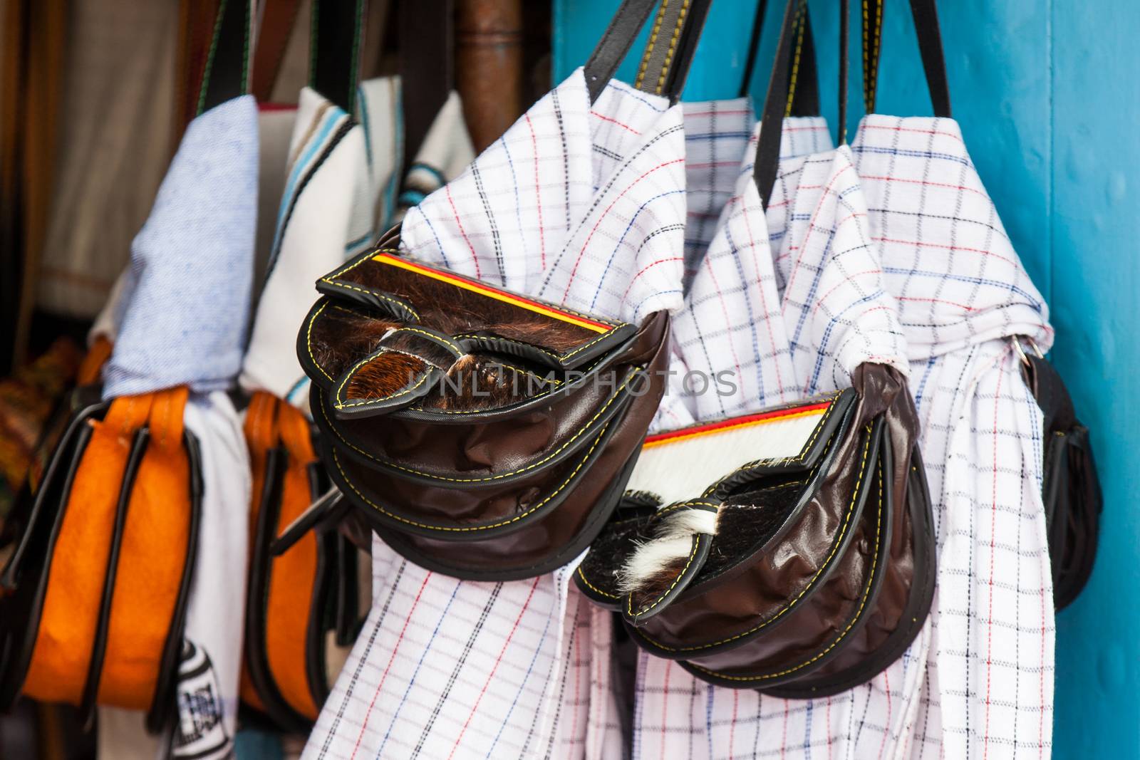 Colombian traditional leather satchel from the Antioquia Region called Carriel and poncho