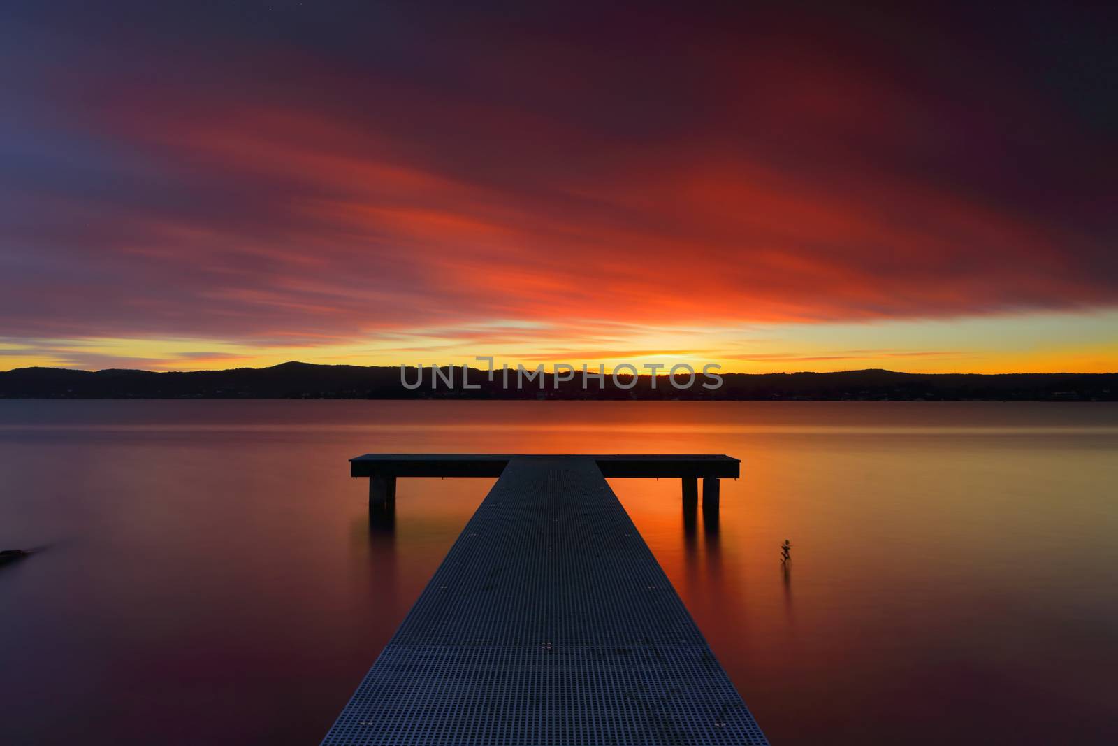 Australian sunsets are unbeatable, the glorious sun sinks just below horizon its last rays emblazing rich colour upon the clouds and painting the waters in similar hues and imprinting upon its onlookers standing in its sunset glow, a quieted soul and an aspirant smile