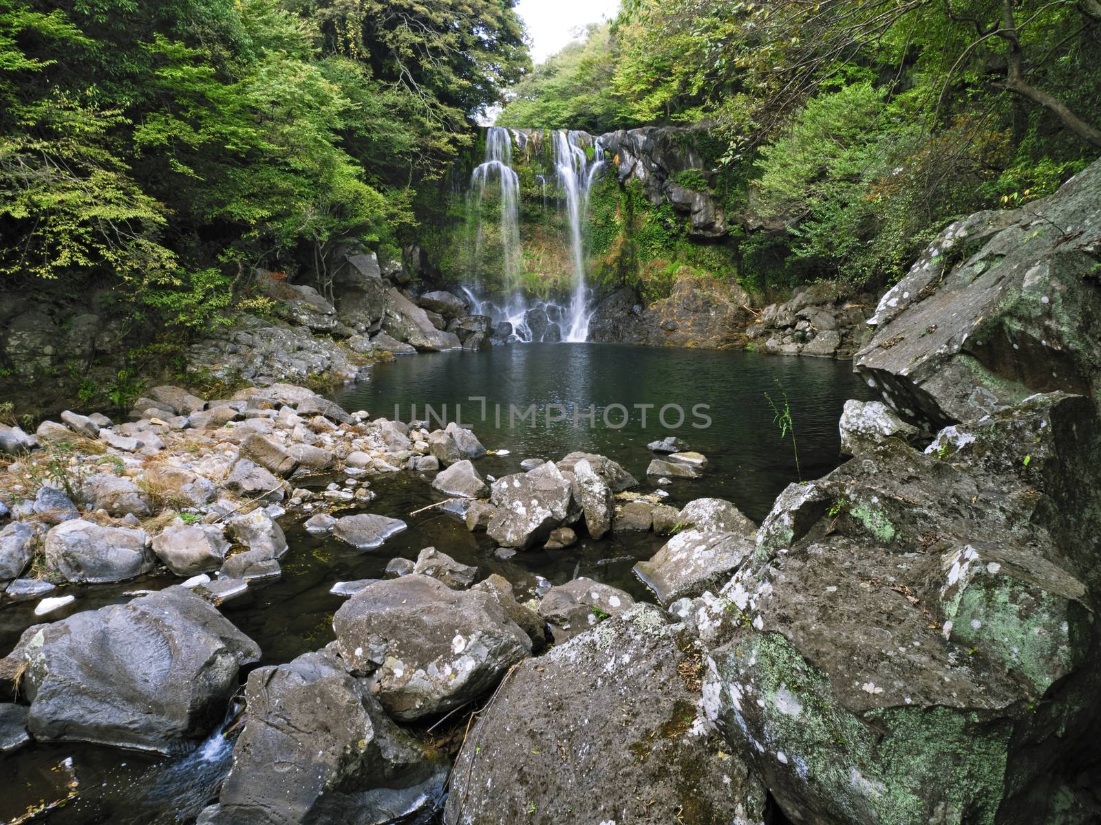 cheonjeyeon waterfall in jeju south korea by zkruger