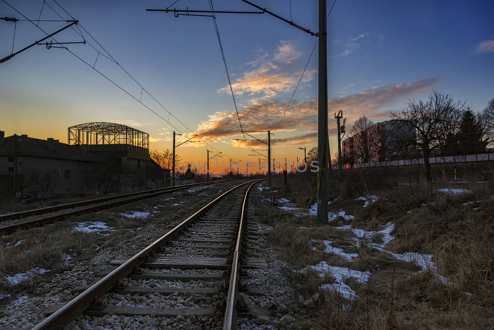 Industrial landscape with railroad and beauty colorful sky. Railway junction.