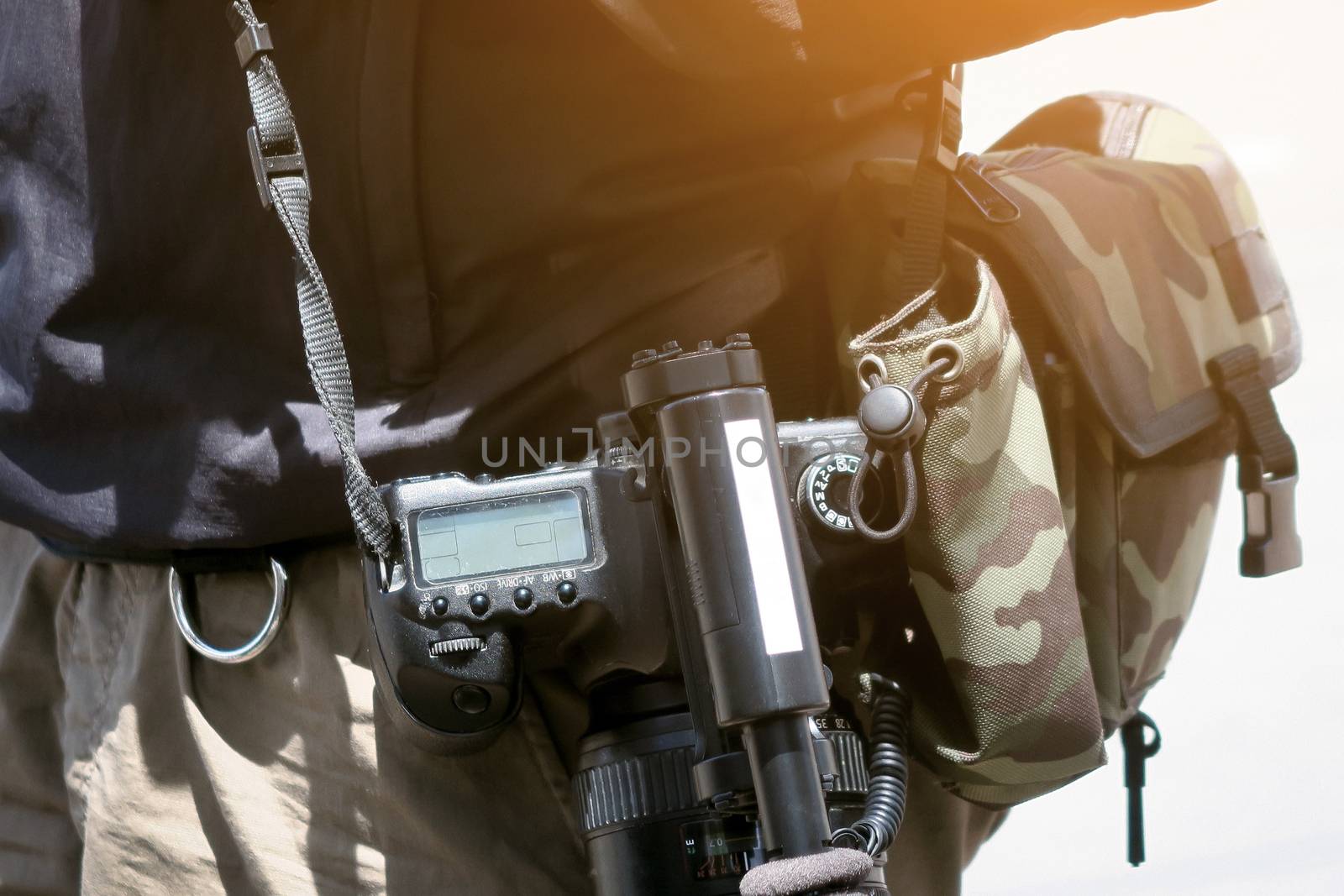 Cameraman with his video camera shooting