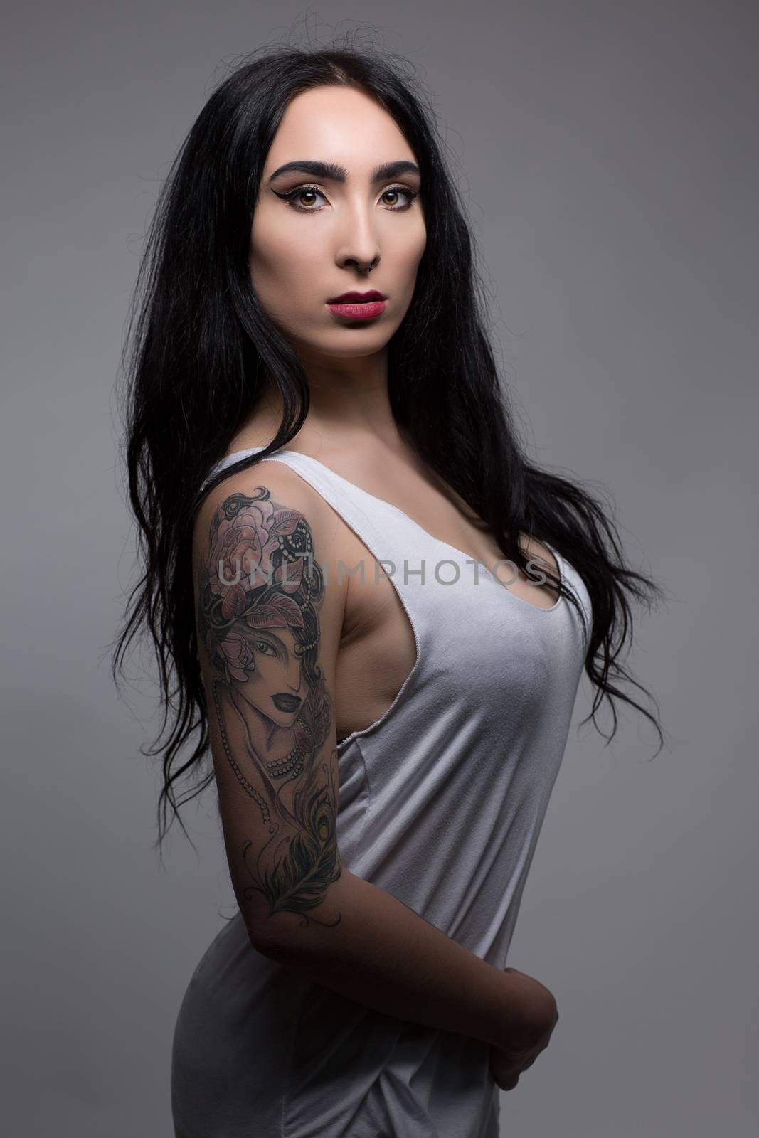 attractive sexy beauty tattoo girl in white sweat shirt