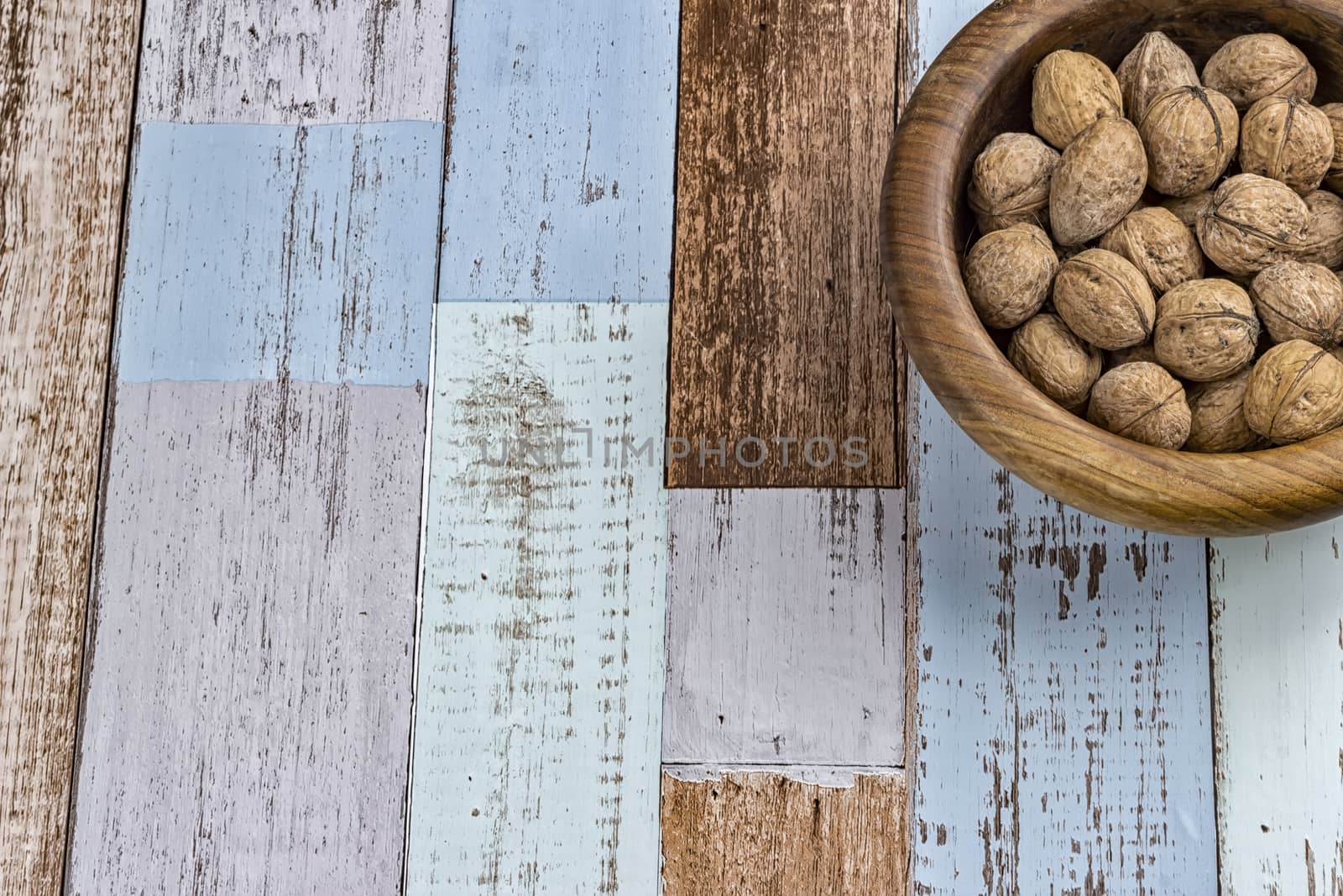 Walnuts in a bowl. On rustic background. Top view