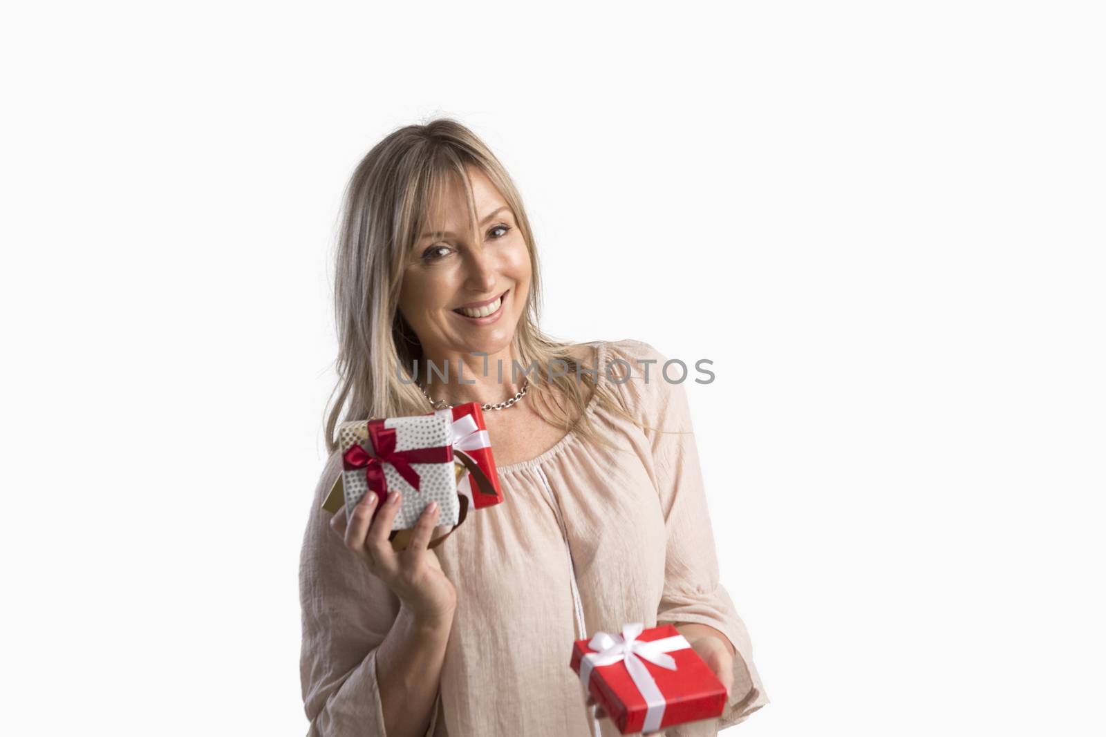 Woman holding wrapped gifts presents and holding one out  Giving, sharing, birthday, Christmas