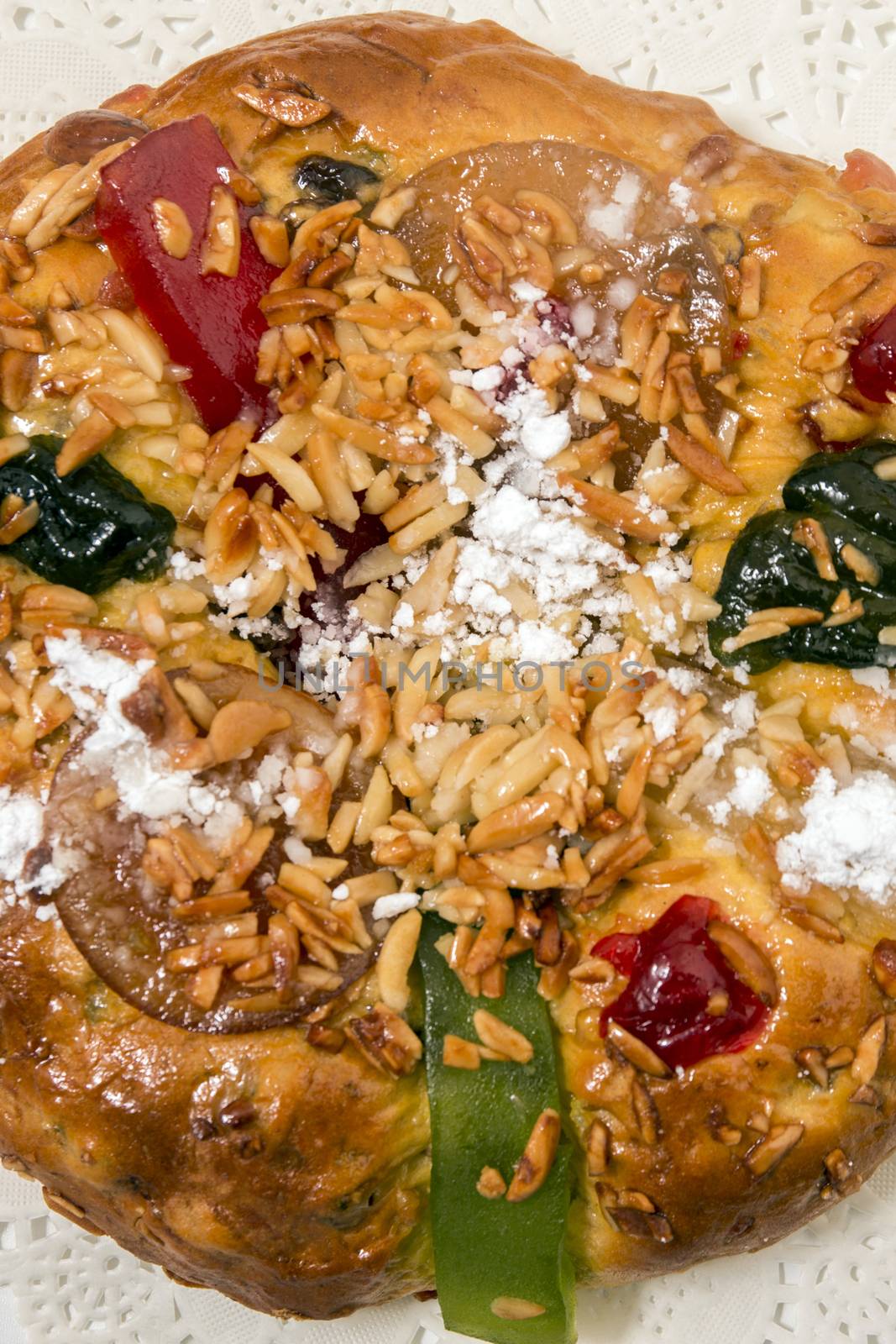 Portuguese King Cake is a famous christmas celebration cake with dry nuts and crystalized fruits.