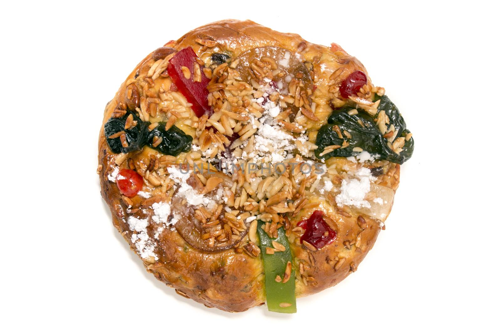 Portuguese King Cake is a famous christmas celebration cake with dry nuts and crystalized fruits.