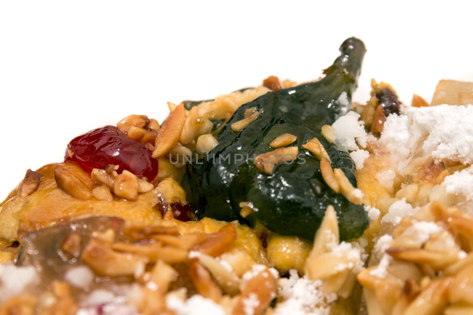 Portuguese King Cake is a famous christmas celebration cake with dry nuts and crystalized fruits.