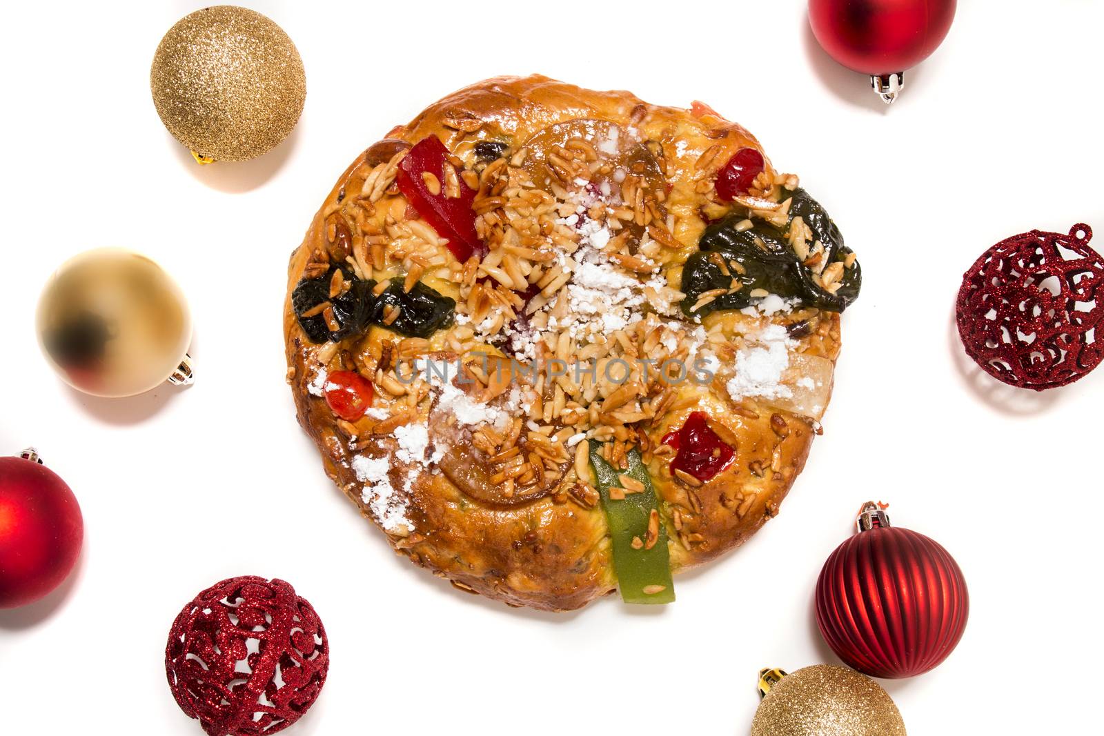 Portuguese King Cake is a famous christmas celebration cake with dry nuts and crystalized fruits.