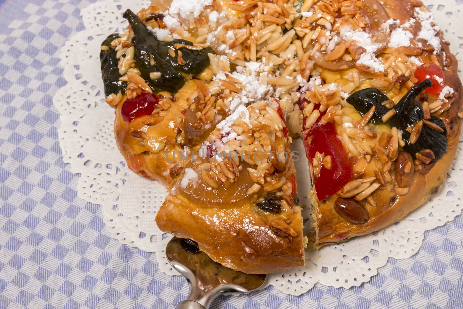 Portuguese King Cake is a famous christmas celebration cake with dry nuts and crystalized fruits.