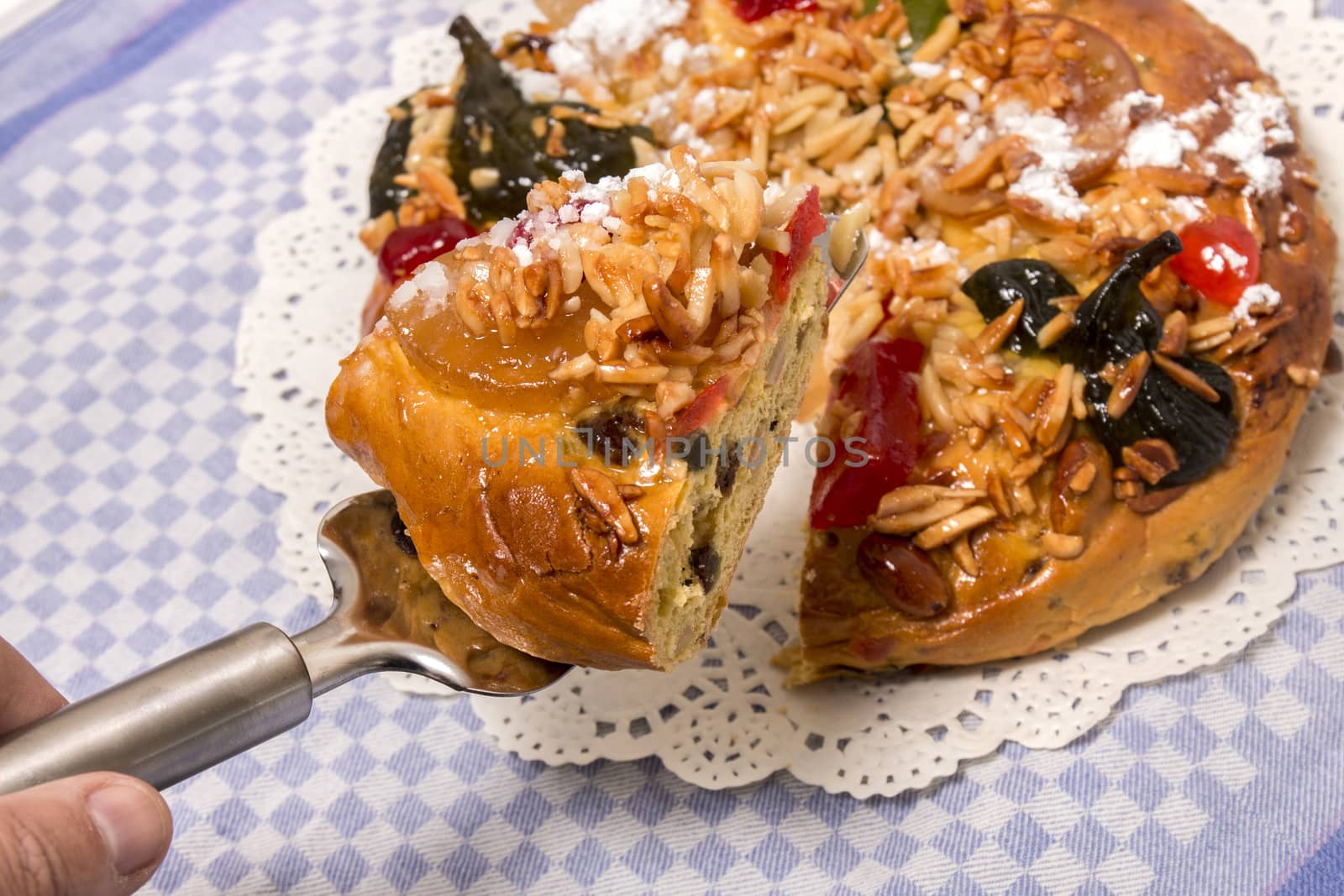 Portuguese King Cake is a famous christmas celebration cake with dry nuts and crystalized fruits.