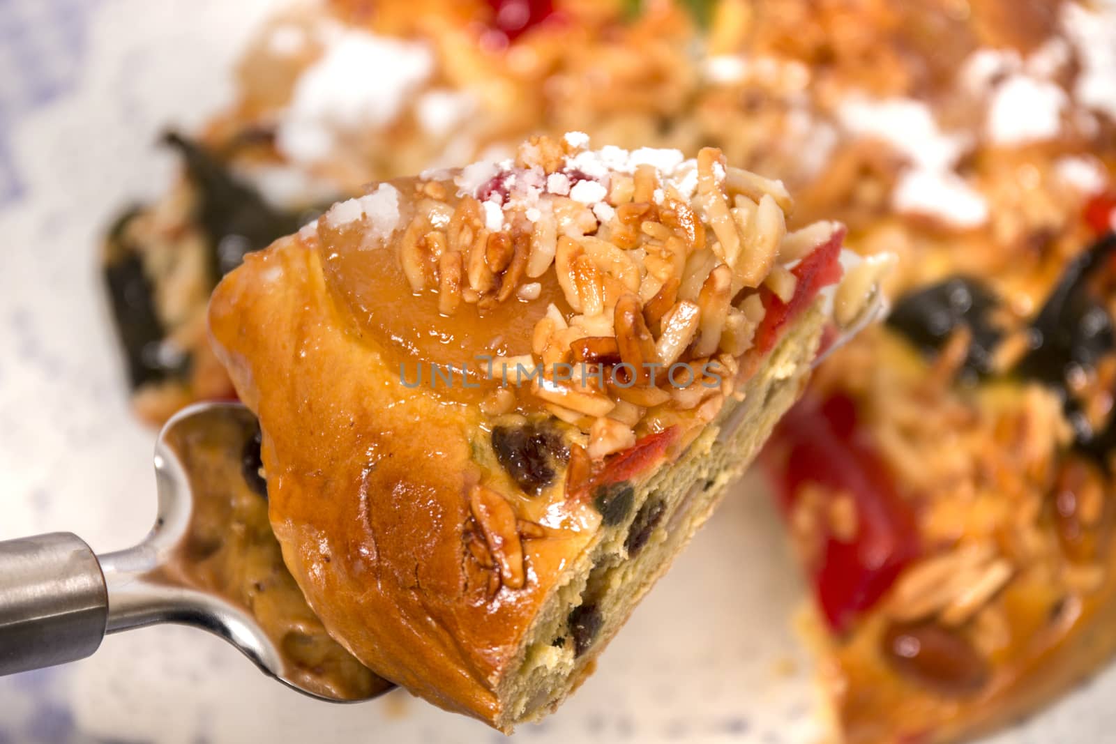 Portuguese King Cake is a famous christmas celebration cake with dry nuts and crystalized fruits.