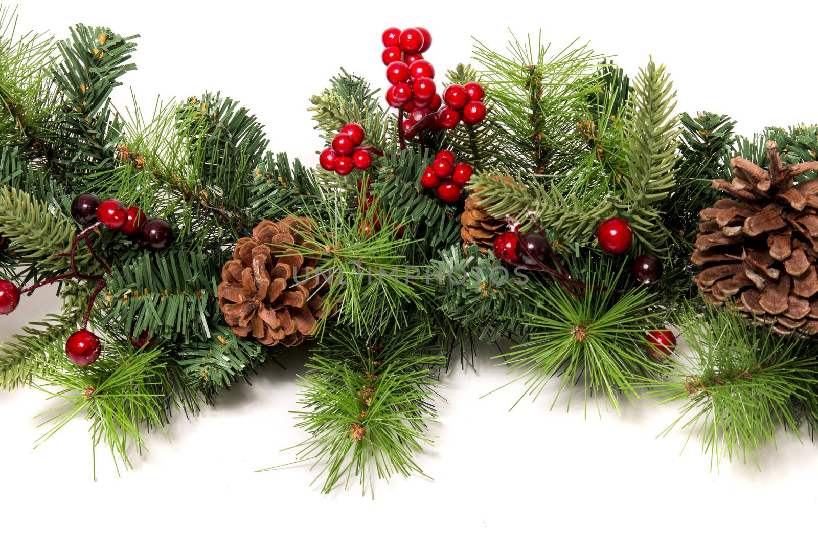 Typical Christmas decorative garland isolated on a white background.