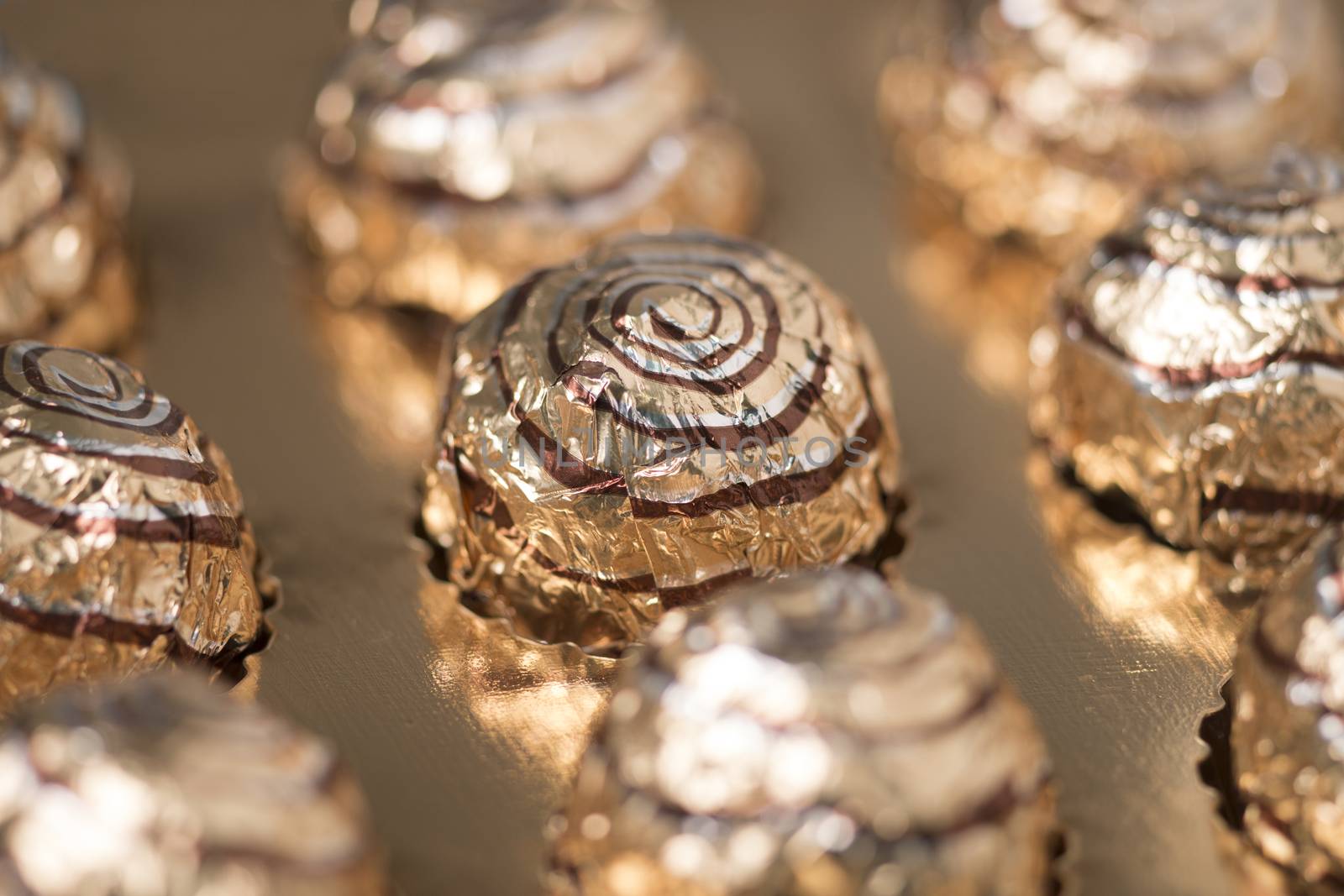 Box of sweet round chocolate candies for christmas celebrations.