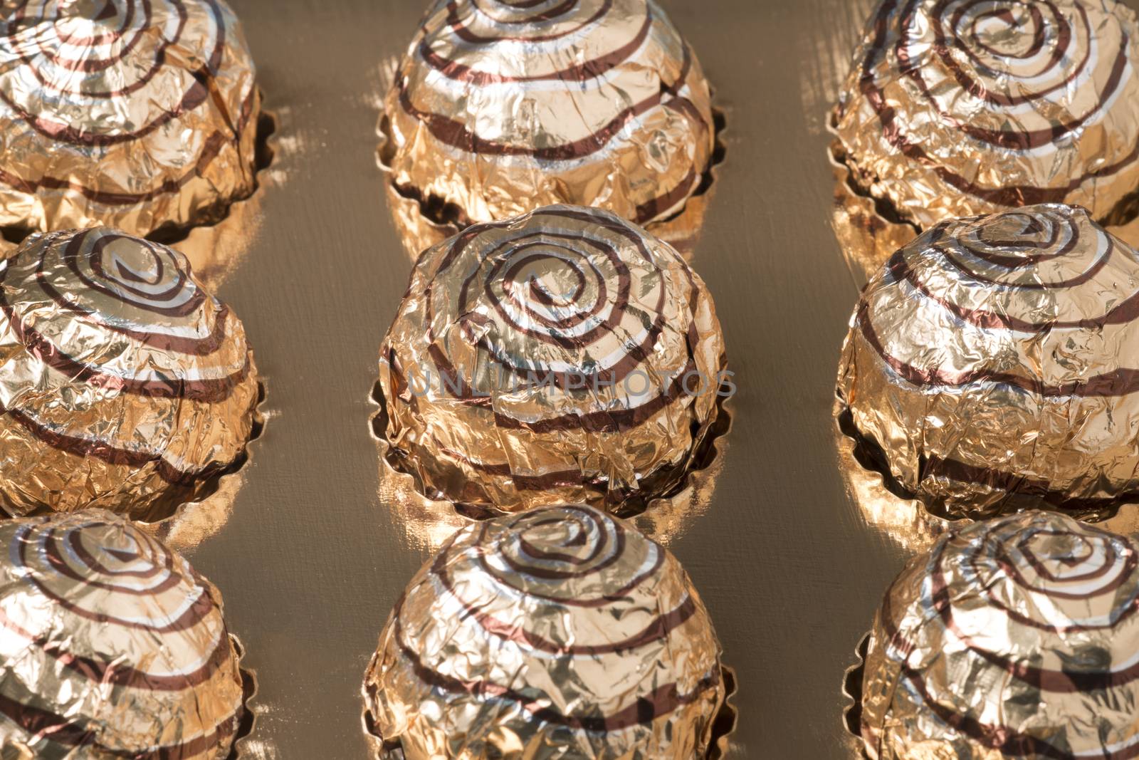 Box of sweet round chocolate candies for christmas celebrations.