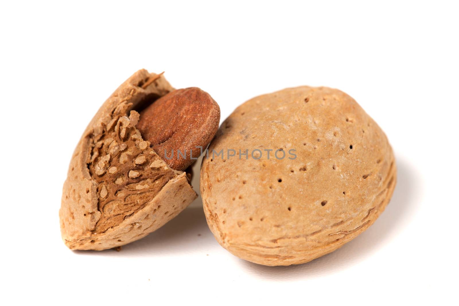 Sweet almonds with seeds isolated on a white background.