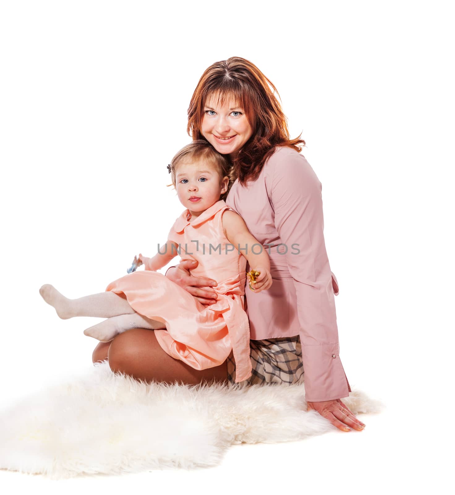 Mother holding ywo years daughter isolated on white