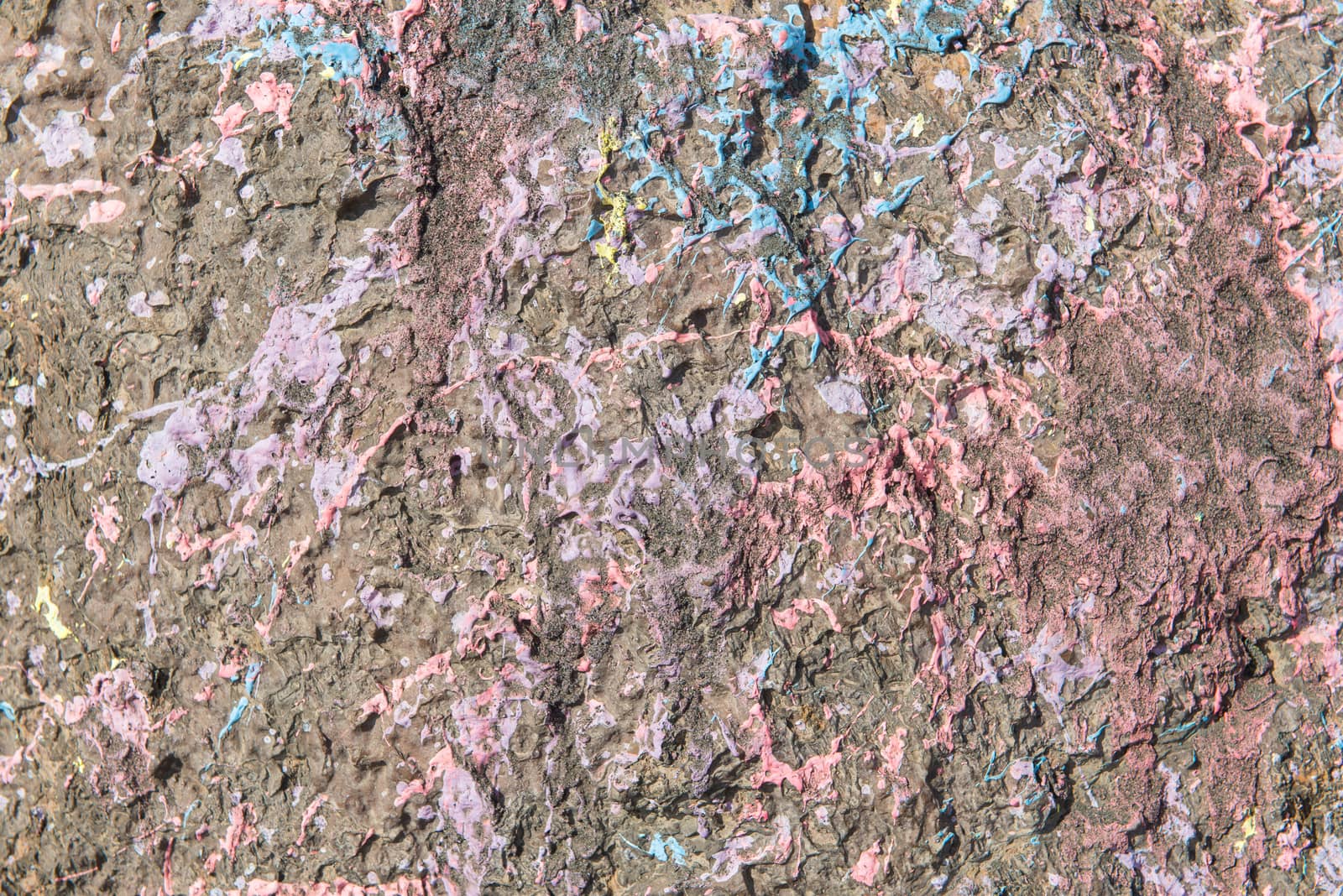 texture detailed of splashes color on stone for background and design.