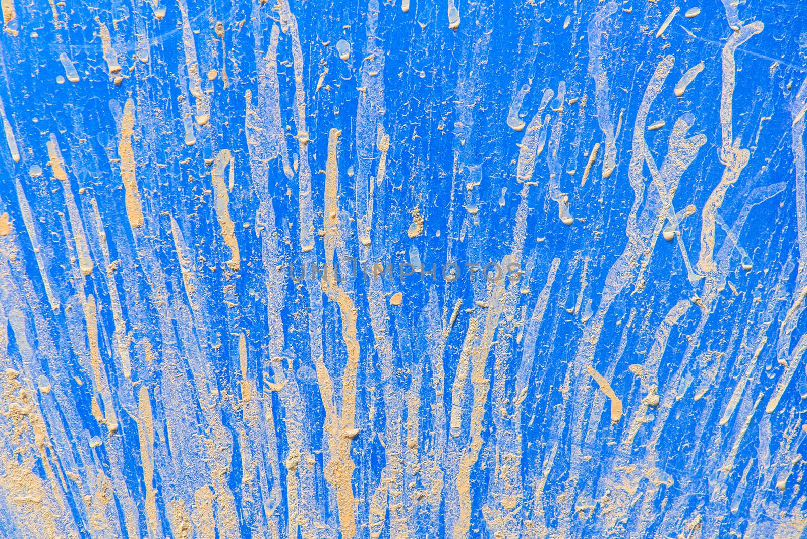 close up of texture background splashes of mud on blue car.