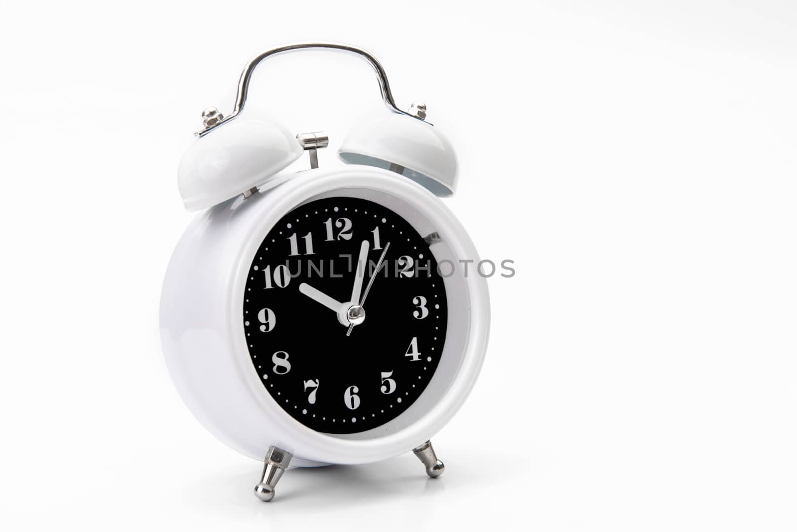 Retro alarm clock isolate on white backgound.