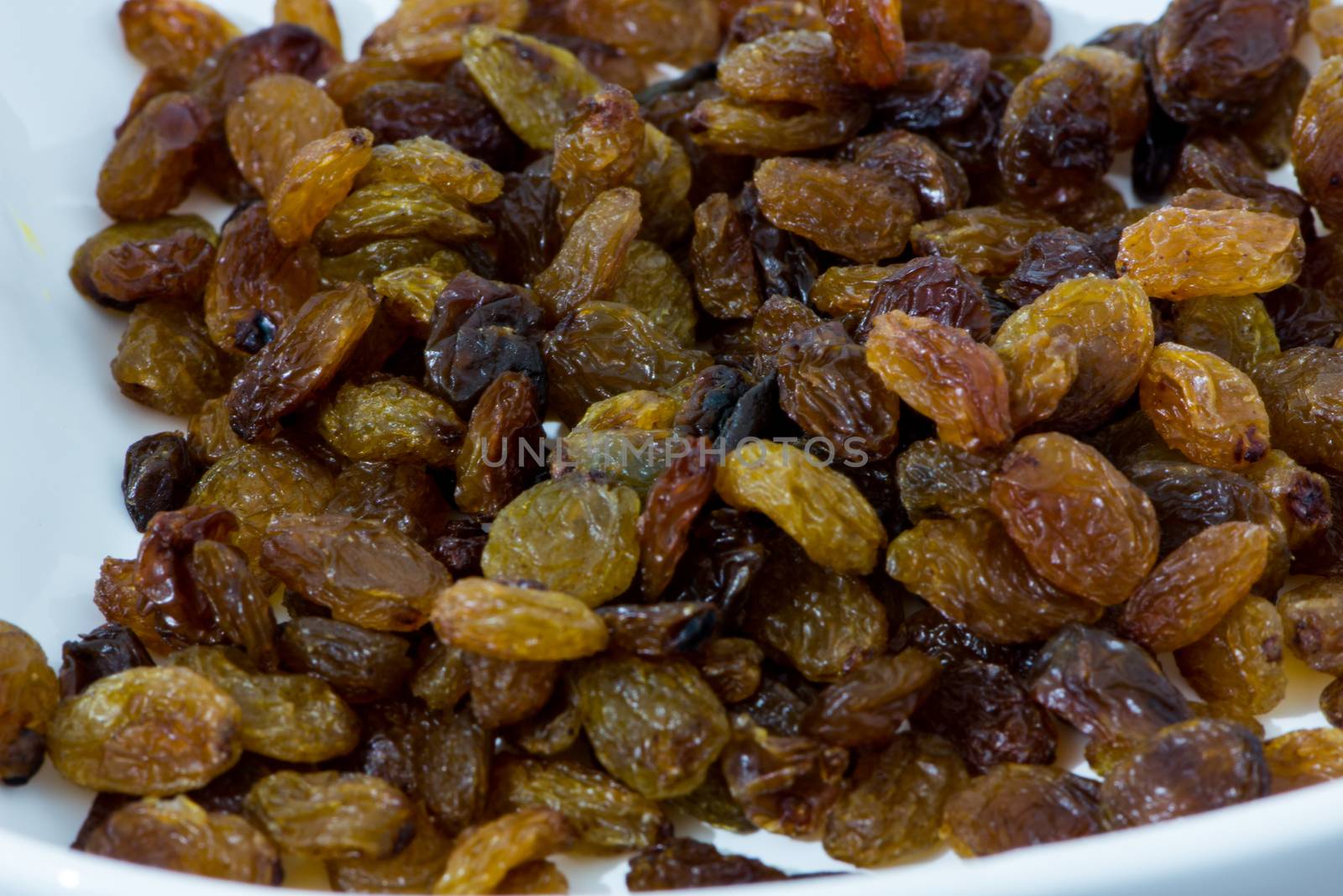 closeup shoot of the pile of organic dry raisins