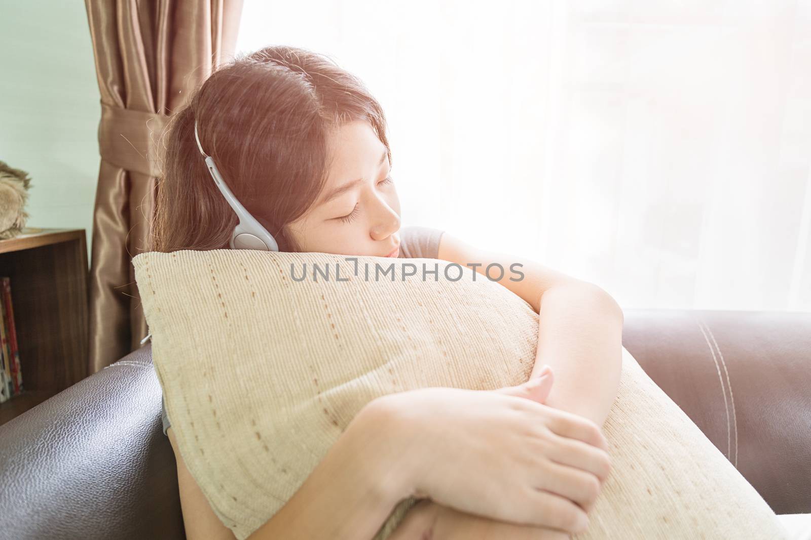 Asian woman short hair listening music  by stoonn