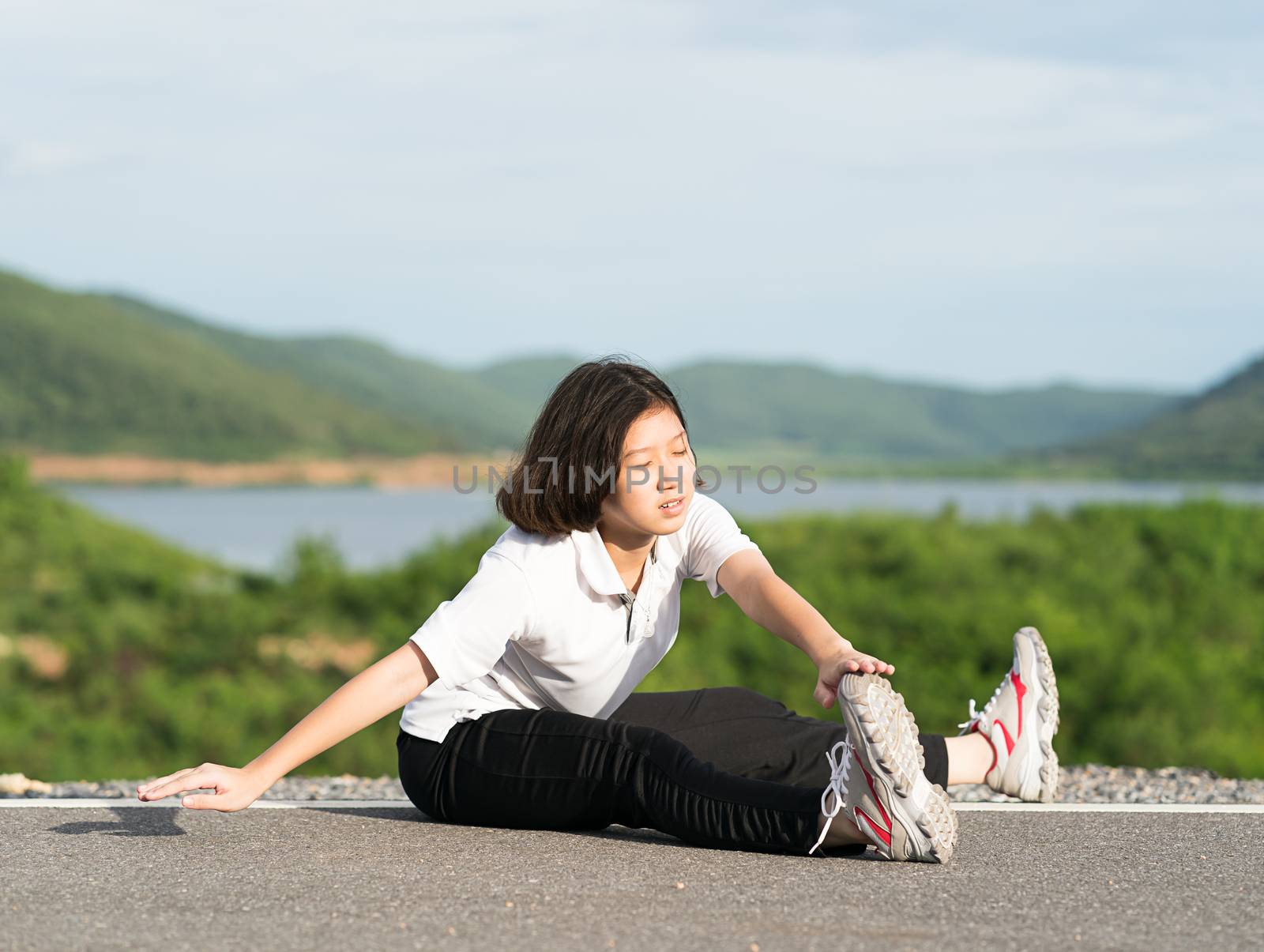 Woman preparing for jogging outdoor by stoonn