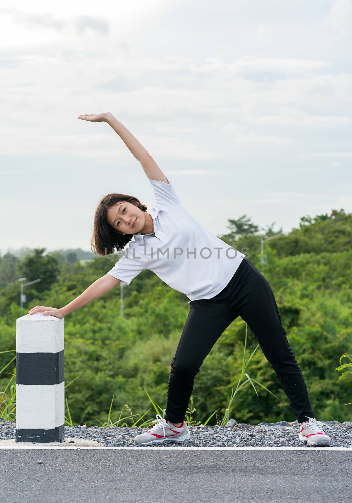 Woman preparing for jogging outdoor by stoonn