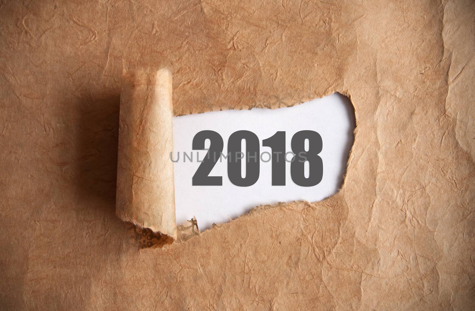 Torn piece of scroll uncovering 2018  underneath