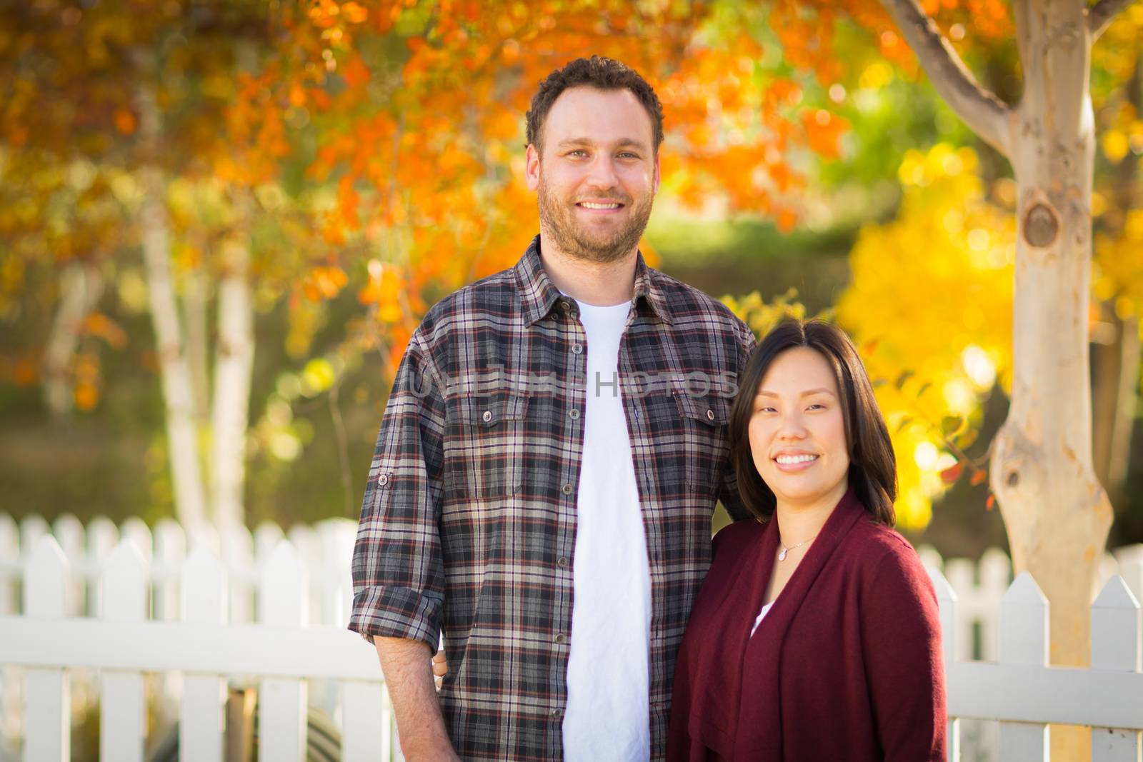 Outdoor Fall Portrait of Chinese and Caucasian Young Adult Couple. by Feverpitched